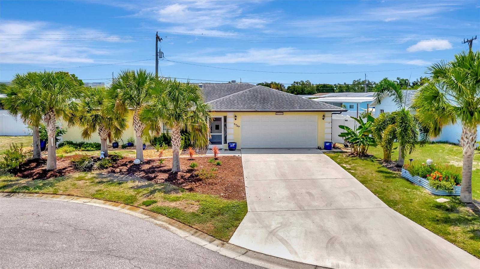 LOCATION, LOCATION, LOCATION!  Welcome to Paradise and this beautifully maintained property located at 5729 Augusta Circle, Sarasota Florida.  Nestled in the desirable Sunrise Golf Club Estates community, this beautifully maintained Sarasota home offers the perfect blend of comfort, convenience, and Florida lifestyle. Featuring a spacious split-bedroom floor plan with approximately 1,676 square feet of living space, this residence boasts two bedrooms, two bathrooms, and a two-car garage on an oversized homesite. Interior highlights include tile flooring throughout the home, a wood-burning fireplace, walk-in closets, and an inviting open layout designed for everyday living and entertaining. The private screened pool and hot tub creates your own backyard retreat, ideal for relaxing or hosting family and friends. Conveniently located near Palmer Ranch near shopping, dining, golf, the Legacy Trail, and world-famous Siesta Key Beach, this property offers exceptional value and easy access to everything Sarasota has to offer. Whether you're seeking a full-time residence, seasonal getaway, or investment opportunity, this home delivers the Florida lifestyle for which you've been looking.
