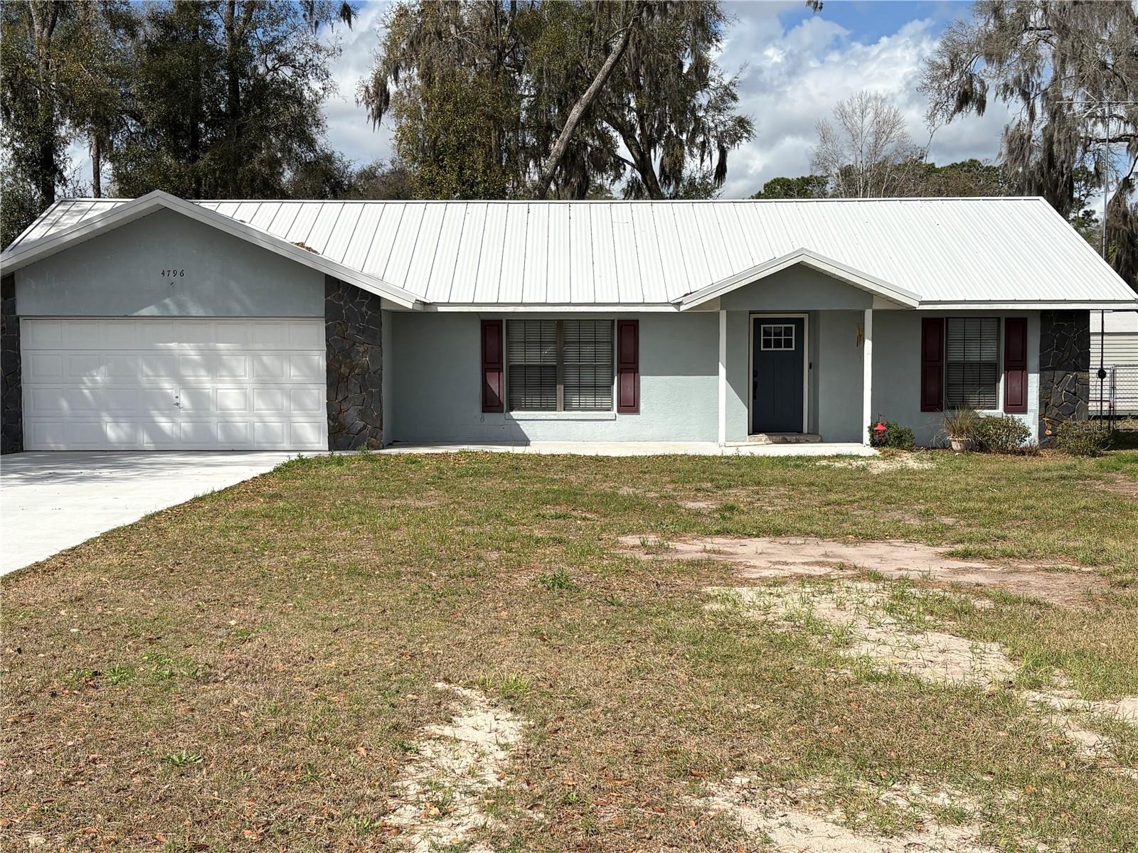 This is a nice home on almost an acre lot that is 141' x 262'. the home has a recent metal roof, recent water heater, recent drain field, recent stove and microwave, recent screened enclosure and a recent driveway and sidewalk. The property is clean and solid home with endless possibilities. It is situated on a dead end road so the traffic is limited but it is is located near schools, shopping and offers easy access to the interstate but still in the country. The property has a nice garden area to grow your own vegetables.