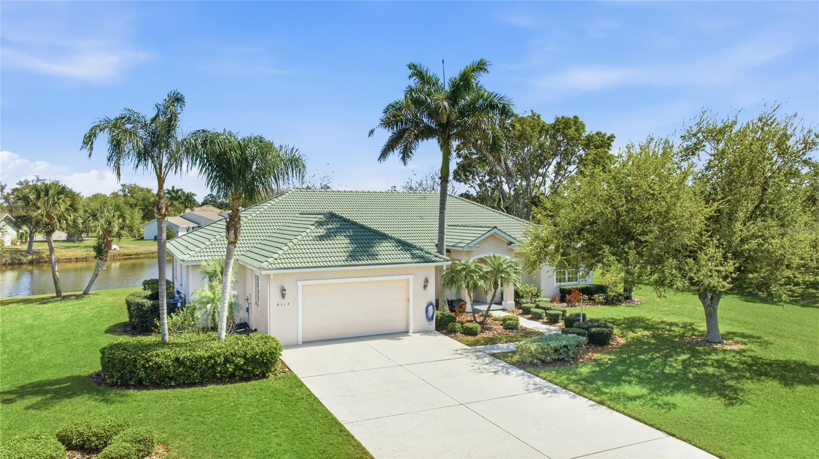 Why pay over a Million Dollars for water property, when this home has many things added and ready for you to enjoy! Tucked away at the end of a quiet cul-de-sac in the gated waterfront community of Cypress Creek Estates, this beautifully maintained home now stands out as one of the best values in the neighborhood, currently the lowest priced home in the community. Set on an expansive 1.03-acre waterfront lot with its own private fishing dock, the property offers 4 bedrooms, 3 full bathrooms, and just under 3,000 square feet of living space, surrounded by peaceful lake views, also known locally as a bayou off the Manatee River, and mature Florida landscape. Recent updates provide both comfort and peace of mind, including impact windows, a NEW 5-ton HVAC system, NEW water heater, NEW flooring throughout with absolutely NO CARPET, updated fans, garage floor coating, a new garage opener and motor coils, along with most kitchen appliances replaced within the past three years, making this home truly move-in ready. Inside, soaring vaulted ceilings accented by wood beams create an immediate focal point in the main living area. Natural light fills the space through large sliding glass doors that showcase tranquil water views and open to the screened lanai, creating an easy flow for everyday living and entertaining. A stone fireplace adds warmth and character to the living room, while the kitchen features granite countertops, stainless steel appliances, and generous cabinetry, all opening seamlessly to the main living areas. A bright breakfast nook is surrounded by windows overlooking the water. The main portion of the home includes three bedrooms and two full bathrooms, including a spacious primary suite with water views and an updated en-suite bath with dual vanities and a walk-in shower. An attached bonus living area offers exceptional flexibility with a secondary primary suite, full bathroom, and an additional bonus room currently used as an office. With its own private exterior entrance, this space is ideal for guests, extended family, or multi-generational living. Additional bedrooms and a den or flex space provide even more versatility for work or hobbies. The oversized laundry room adds functionality and includes a queen-size Murphy bed for added guest accommodations. Outdoors, the screened lanai and private dock create a peaceful setting to relax, fish, or enjoy the natural surroundings. The expansive homesite, mature landscaping, and cul-de-sac location offer a level of space that is increasingly rare. Throughout the seller’s ownership, the community has not experienced flooding, adding confidence to this waterfront setting. Cypress Creek Estates is known for its winding streets, large homesites, and natural beauty, all while remaining conveniently close to shopping, dining, and everyday essentials including Costco, Target, and a growing number of nearby restaurants and shops. **THIS PROPERTY QUALIFIES FOR A 1% LENDER INCENTIVE IF USING PREFERRED LENDER. INQUIRE FOR MORE DETAILS.**