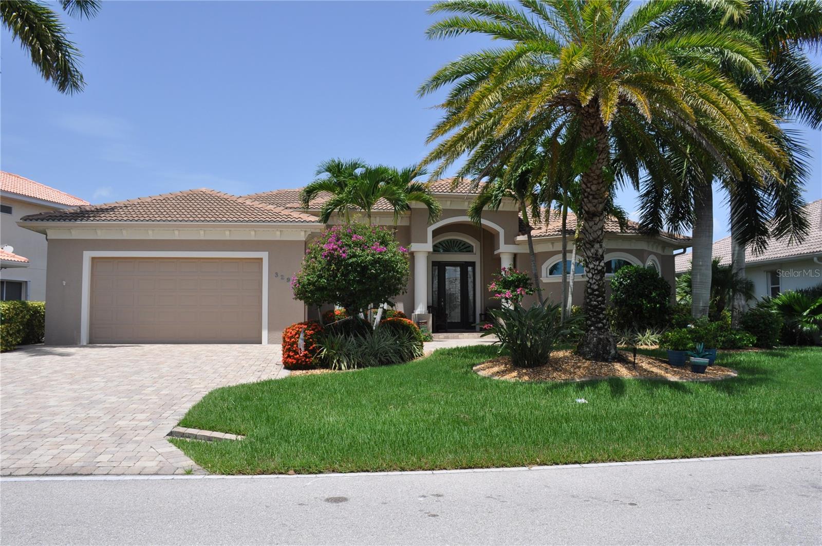 PROFESSIONAL PICTURES COMING SOON!!!-Experience the very best of Southwest Florida waterfront living in this beautifully maintained, Furnished-Turnkey home is located in the boating community of Burnt Store Isles. This 3 Bedroom (possible 4th), 2 Bath, 2 Car Garage, 2,560 square foot home on SAILBOAT WATER has an impressive LONG CANAL VIEW. Offering 80 feet of city-maintained CONCRETE SEAWALL, a 45-FOOT CONCRETE DOCK, a 10,000-pound BOAT LIFT with new motors, and quick boating access to Charlotte Harbor and the Gulf of Mexico. From the moment you enter the home, the dramatic corner pocketing sliding glass doors breathtaking water views become the focal point of the home, as indoor and outdoor living blend seamlessly together. Elegant double tray Vaulted ceilings with crown molding, abundant natural light, and tile flooring throughout the main living areas and all bedrooms, create an open, spacious atmosphere designed for both everyday living and entertaining. The GREAT ROOM showcases double tray ceilings with backlighting and crown molding. The  pocketing corner sliders open the home to the oversized screened lanai. Adjacent to the foyer, the private office features beautiful wood flooring and a built-in closet, making it an ideal home office or optional 4th bedroom. The dining area also enjoys corner pocketing sliders overlooking the waterfront. The well-appointed kitchen is designed for both functionality and style with granite countertops, tiled backsplash, soft-close maple cabinetry, pull-out pantry drawers, stainless steel appliances, glass cooktop, wine cooler, pendant lighting, and an oversized breakfast bar perfect for gathering with family and friends. The spacious primary suite is a true waterfront retreat featuring tile flooring, elegant double tray ceilings with crown molding, ambient backlighting, 10-foot sliding doors to the lanai, and a large walk-in closet. The luxurious ensuite bath has dual vanities with granite countertops, maple cabinetry, a private water closet, linen storage, a relaxing soaking tub, and an oversized dual-entry walk-in shower complete with a rain shower head. The split-bedroom floor plan provides privacy for family and guests. Both guest bedrooms feature crown molding, while one offers direct access to the lanai. The guest bath includes a walk-in shower, wood cabinetry, and conveniently serves as a pool bath. Outdoor living is where this home truly shines. Relax in the heated pool and spa, efficiently warmed with solar heating, or an electric heat pump. Enjoy  the spectacular canal views from the oversized paver lanai. Entertain with ease using the outdoor bar sink, outdoor shower, two storage closets, and a dedicated electrical outlet already in place for a future beverage cooler. The oversized garage is equally impressive, featuring epoxy flooring, stainless steel cabinetry, utility sink, overhead storage, attic access, and a generator hookup. Additional features include: •New air conditioning system (2024) •New water heater (2024) •Complete Hurricane protection •Central vacuum system •Security alarm system •Gutters •Landscape lighting •New no-see-um screens (2024) •New motors for the 10,000-pound boat lift.Offering exceptional boating access, quality construction, thoughtful upgrades, and being sold fully furnished turnkey, this Burnt Store Isles waterfront residence is truly move-in ready and provides the perfect opportunity to begin enjoying the Southwest Florida lifestyle from day one!