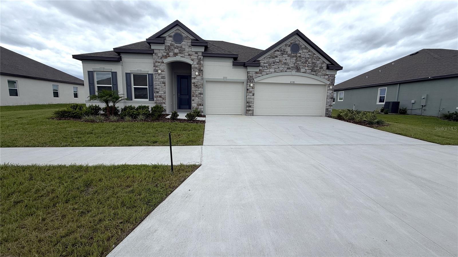 MOVE IN READY! Experience elevated living in The Venice floor plan at Applewood Reserve, Lakeland's newest community, where oversized homesites, peaceful preservation views, and a charming wooden bridge with a dedicated pedestrian path create a picturesque setting. Situated on an oversized homesite backing to beautiful greenspace with no rear neighbors, this home combines privacy, style, and exceptional upgrades, beginning with its attractive stone accent exterior and inviting curb appeal.
Inside, the spacious foyer has 9'4" ceilings and then an impressive 11' tray ceiling in the Great Room creates an open, airy feel, while wood look ceramic tile flooring flows throughout the entire home. The Great Room, enhanced with additional lighting, opens through sliding glass doors to a covered lanai, creating the perfect space to relax or entertain while enjoying tranquil conservation views.
At the center of the home, the chef-inspired kitchen shines with a large island, quartz countertops, tile backsplash, and a full line of stainless steel appliances including an eStar refrigerator, seamlessly connecting to the dining area and Great Room for effortless everyday living.
The spacious primary suite is a true retreat, highlighted by a tray ceiling, generous layout, and a luxurious bath featuring quartz countertops, a separate soaking tub, and an upgraded tiled shower. Three additional oversized bedrooms provide outstanding flexibility, including a highly sought after private guest ensuite with private bath & walk-in closet that delivers exceptional comfort and privacy. A den with double French doors creates the ideal home office, library, or hobby room.
Additional highlights include a three car garage, landscaped yard with irrigation, Ring Video Doorbell, Smart Thermostat, Keyless Entry Smart Door Lock, integrated security system, and a full builder warranty for added peace of mind.
Applewood Reserve blends peaceful country living with thoughtfully designed amenities, including a pet friendly atmosphere, oversized homesites, preservation areas, and scenic walking paths. The Venice showcases designer finishes, spacious living areas, and modern smart home technology in one exceptional move in ready home. Schedule your private tour today.