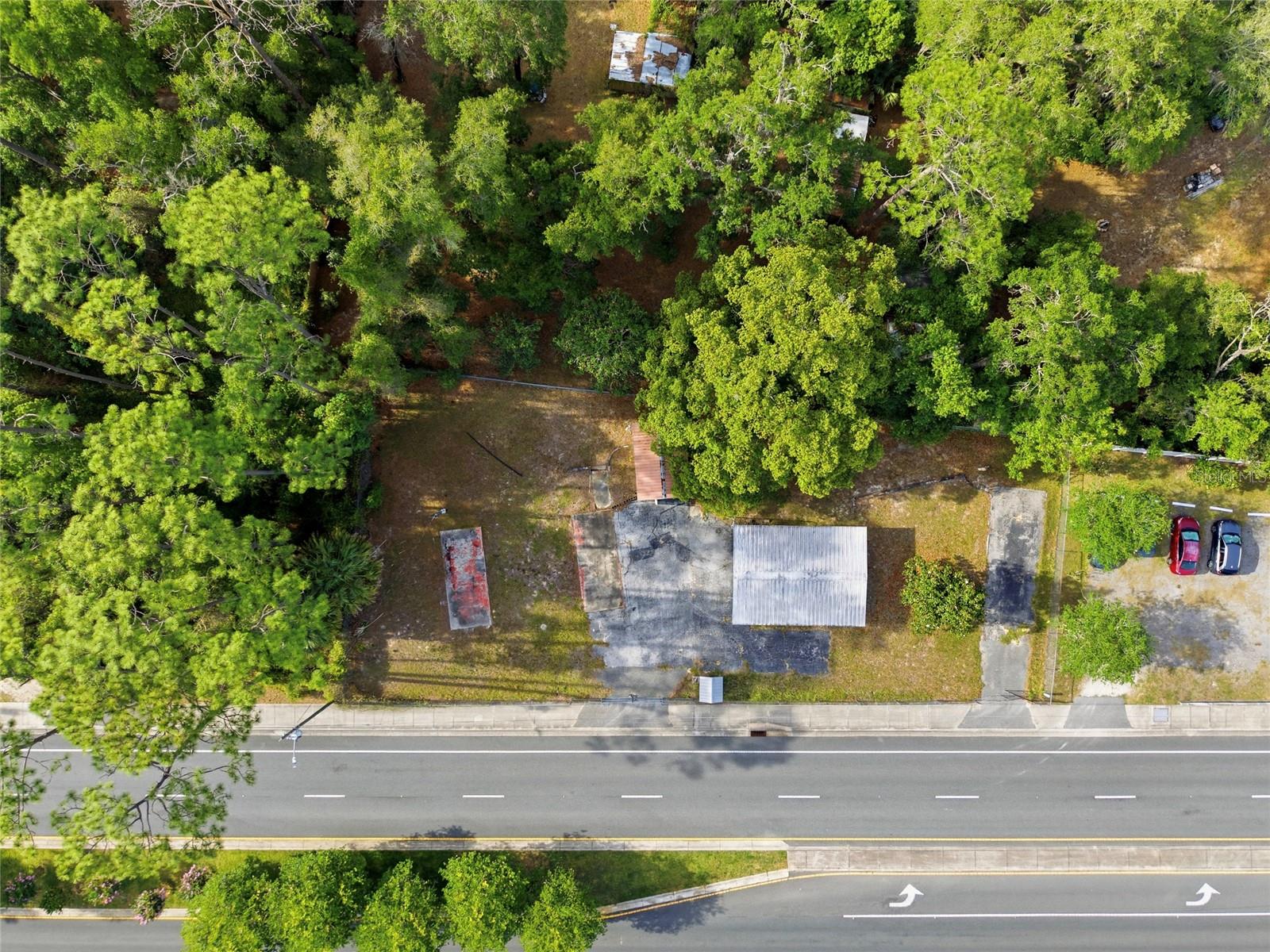 Vacant commercial land opportunity located on highly traveled Hwy 466 in Lady Lake, FL. This cleared parcel, previously improved with mobile structures (now removed), offers a ready-to-develop site with excellent visibility and road frontage. Zoned LC (Light Commercial), the property allows for a variety of potential uses including retail, office, and service-based businesses (subject to county approval).

Positioned near The Villages, one of the fastest-growing communities in the nation, the site benefits from strong traffic counts, nearby retail, medical facilities, and ongoing residential expansion. Ideal for investors, developers, or end-users seeking a strategic location within a high-growth commercial corridor. Workshop/Shed shown in photos will convey with sale of property. Don't miss out on this opportunity!