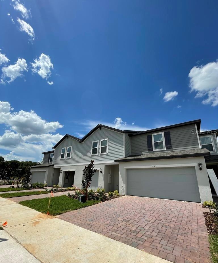 This beautiful new townhouse- CORNER UNIT, only one neighbor, a lot of natural light- with 3 bedrooms, 2.5 bathrooms, 2-CAR GARAGE in the Union Square Community is surrounded by excellent restaurants, schools, hospitals, shops, and at the entrance of I-4. LARGEST floor plan in the community. This community is a short distance from an abundance of retail, dining, and recreation areas, including Walt Disney World, Universal Orlando.