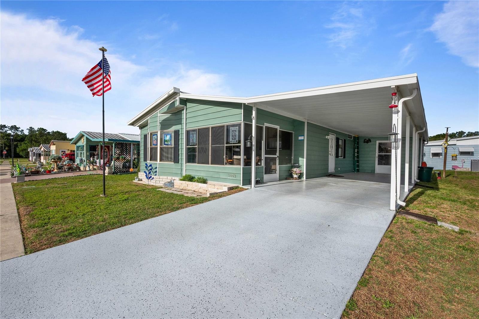 **Price Improvement – Now $139,900!**
Welcome to Terrace Park, a desirable 55+ community where you own the land! This well-maintained home offers numerous updates and features designed for comfortable Florida living. The metal roof has recently been serviced, and the plumbing has been upgraded to PEX for added peace of mind. The kitchen features upgraded cabinetry, new laminate flooring, and newer appliances, creating a functional and attractive space for everyday living. The dining area includes built-in cabinetry and flows seamlessly into the spacious living room, making it ideal for entertaining family and friends. Enjoy your morning coffee in the inviting Florida room at the front of the home, or relax in the screened front porch while enjoying Florida's beautiful weather. The primary bedroom is privately situated at the rear of the home and features a spacious en-suite bathroom along with an impressive walk-in closet. The second bedroom is generously sized and offers built-in closets for ample storage. The hall bathroom includes a tub as well as an updated vanity, sink, and toilet. Convenient laundry facilities are located in the attached 8' x 10' utility room just off the carport. An additional storage building has been added to the rear of the home, providing even more space for tools, hobbies, and seasonal items. Outside, you'll find a covered double carport with tandem parking, offering plenty of room for vehicles and guests. For added comfort and efficiency, a new air conditioning system and ductwork were installed in 2023. **Now offered at just $139,900!** Schedule your private tour today and discover all that this wonderful home has to provide. Homes in Terrace Park don't stay on the market long!