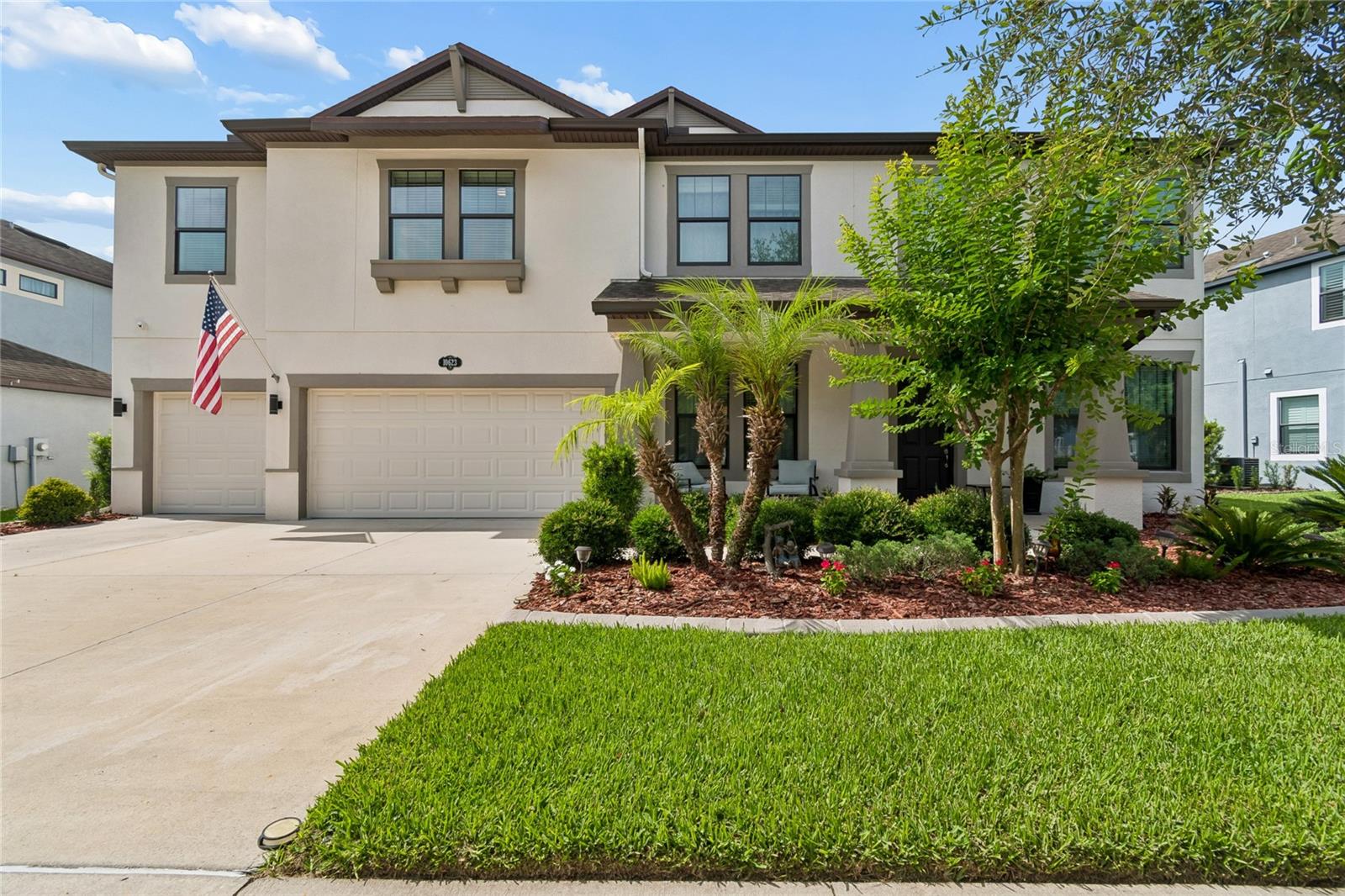 Experience lakefront living in this extensively upgraded 6-bedroom, 4.5-bath home in K-Bar Ranch. Positioned on one of the largest homesites in the community (75' x 130'), this property offers panoramic water and conservation views, no rear neighbors, and approximately 60 feet of usable backyard space plus additional green space leading to the lake for enhanced privacy.

Designed for comfortable living and entertaining, the home features a first-floor guest suite, private office, dedicated Home Theater, formal living and dining rooms, and a oversized Great room (36" x 20") that opens to the kitchen and café area then continues to the family room. Impact-resistant windows and double French doors bring in abundant natural light while showcasing the waterfront setting.

The oversized screened lanai (26’x11’) overlooks the expansive backyard, providing plenty of room for recreation, entertaining, or a future pool. A dedicated 60-amp pool-ready electrical connection is already installed.

The kitchen is equipped with a large 36-inch built-in cooktop, premium 36-inch dual-fan vent hood, upgraded stainless steel appliances, abundant cabinetry, and a counter-depth professional refrigerator/freezer offering 37.2 cubic feet of storage.

The owner's retreat features dual customized walk-in closets and a spa-inspired bath with a multi-jet body spray shower system. Premium carpeting with upgraded 1-inch padding adds comfort throughout the second floor.

Built with significant structural, electrical, technology, and energy-efficiency upgrades, this home stands apart from typical construction. Features include reinforced framing components, impact-resistant windows and doors, radiant barrier roof decking, upgraded insulation, enhanced attic ventilation, dual-zone variable-speed HVAC, and a hybrid water heater designed to improve comfort and reduce energy consumption.

The home's technology infrastructure includes whole-home CAT-6 networking (for better image on 4k TVs), integrated surround sound, smart lighting controls, dedicated media wiring, and extensive future-ready prewiring. The dedicated theater room includes a 150-inch projection screen, Sony 4K projector, Dolby Atmos 7.1 surround sound system, 16 speakers, and subwoofer.

Security and utility upgrades include a professionally installed 4K surveillance system, monitored alarm system, whole-house surge protection, seamless gutters, ongoing termite protection, whole-home water filtration with UV purification, Culligan water softener, and oversized plumbing lines for strong water pressure.

The finished, 3 Car, Oversized garage (28' x 22') offers custom perimeter cabinetry. The upgraded electrical system includes 200-amp service, dual electrical panels, independent lighting and outlet circuits throughout the home, multiple dedicated 20-amp circuits serving the office, garage, and equipment closet, and infrastructure capable of supporting high-demand electronics.

Combining a premium waterfront homesite, exceptional privacy, extensive upgrades, advanced technology, energy-efficient systems, and flexible living spaces, this is a rare opportunity to own one of K-Bar Ranch's most improved homes. Perfect for buyers seeking space, functionality, and long-term value in New Tampa.

Technical Information, Survey, Floor Plan, and Specification in attachments, contact listing agent
