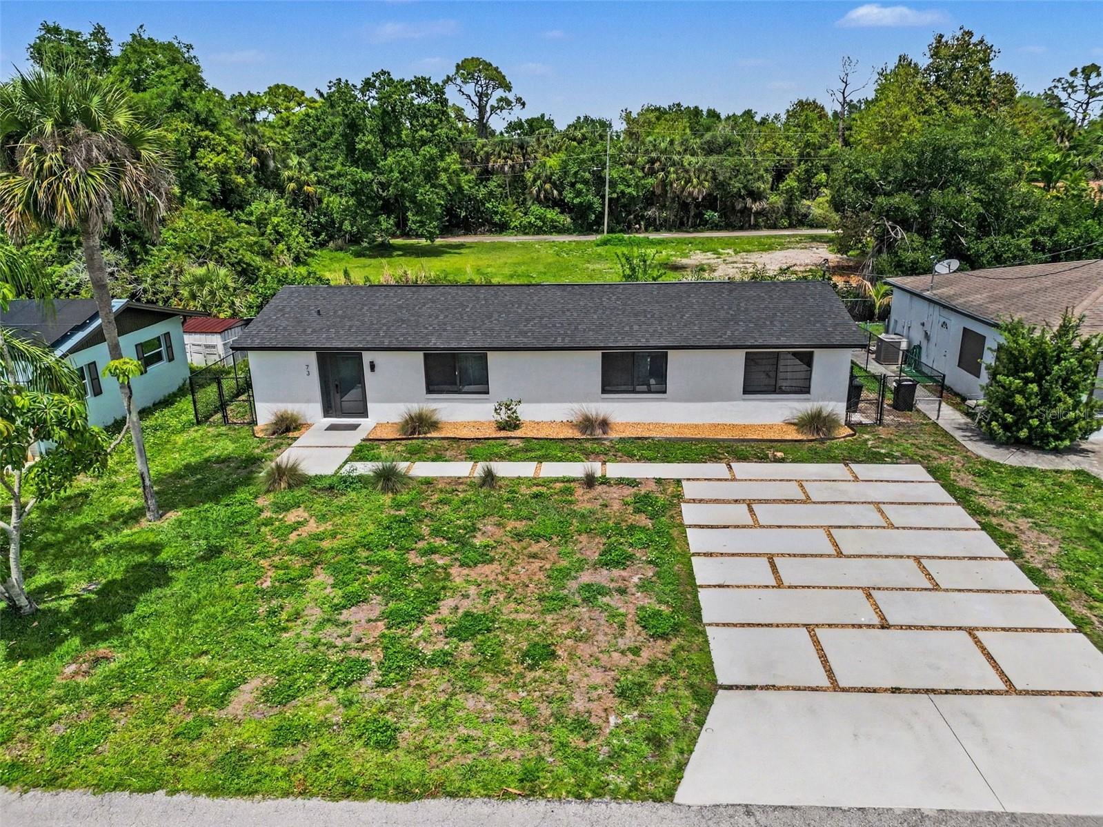 Just What you have been waiting for, a 4-bedroom waterfront home with direct Gulf access, ideally located on a canal just minutes to the Caloosahatchee River. Offering the true Southwest Florida boating lifestyle, you’ll enjoy quick, easy access to open water right from your backyard—with the option to add your own private dock. From the moment you arrive, the modern curb appeal stands out with a newly paved driveway and fresh, clean exterior accented in crisp black and white. Inside, the home features a bright, spacious open-concept layout designed for both everyday living and entertaining. The updated kitchen is the heart of the home, complete with a large island, white cabinetry, stylish backsplash, and brand-new stainless steel appliances. Throughout the home, you'll find sleek, marble-look tile flooring that enhances the light and airy feel. The spacious primary suite offers a private retreat with an ensuite bathroom and walk-in closet, while the additional bedrooms provide flexibility for guests, family, an office, or even a potential in-law setup. Both bathrooms have been thoughtfully updated with modern finishes to match the home’s contemporary design. An oversized laundry room with new washer and dryer adds convenience, along with extra storage space. Step outside to your screened lanai —perfect for relaxing, entertaining, and enjoying Florida’s year-round sunshine. The fully fenced backyard creates a private setting ideal for gatherings, pets, or simply unwinding by the water. Located in North Fort Myers, you're just a short drive to the Downtown Fort Myers River District, where you can enjoy waterfront dining, live entertainment, festivals, and more.