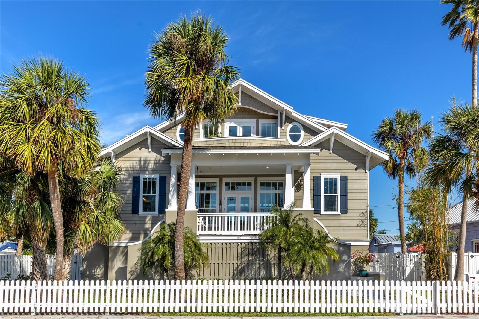New Price!  Location! Location! Location!  First time ever on the market!  Welcome home to the charming beach town of Historic Pass-a-Grille Beach, Florida!!  Located at the southern most tip of St Pete Beach, Pass-a-Grille is famous for its relaxing vibes, white sand beaches on the Gulf of Mexico, beach boutiques, and restaurants.  This gorgeous custom coastal home was built in 2016 by a renowned local builder.  This lovely home combines a luxury aesthetic with all of the modern conveniences the most discerning homeowners would desire.  It occupies an oversized lot on a one way street directly across from a park.  You will love being able to only have a short walk to the beach and everywhere else!  This 3 story elevated home features 3 bedrooms, 2.5 bathrooms, 3 car garage and 2,286 feet of living space to enjoy.  Floor plan is open, spacious and perfectly laid out.  The light and bright interior oozes high end craftsmanship that is visually stunning yet comfortable.  This home literally could be on any cover of Coastal Home magazine!  The second story floorplan includes the open living room with fireplace and custom built-ins, gourmet kitchen, dining area, balcony with swing and water views, covered patio, guest bathroom, laundry room and 2 guest bedrooms. The kitchen features endless quartz counters, stainless steel appliances, gas stove, soft close wood cabinetry, breakfast bar and built-in desk.  You will love the adult-sized bunk beds in guest bedroom 2!  The third floor is all master suite with multiple closets, 2 balconies including a firepit and water and park views.  The master suite also enjoys a bonus room with a coffee bar and open space for yoga, relaxing, etc.!  The master bath is perfectly designed with a walk-in shower, soaking tub, dual vanity and makeup space, all with quartz counters.  The backyard oasis features a sparkling swimming pool with a spillover spa, pavered patio, garden area, and a designated dog run with artificial turf.  You will enjoy the 3 car tandem garage, lots of storage space and plenty of parking.  Pass-a-Grille also has a dog park, dog beach as well as pickleball, tennis and basketball courts just a short walk away!  Also in the neighborhood is a Marina and a public boat ramp.  This is truly a No Brainer...A Gorgeous Home in a highly desirable beach town in paradise!  Make your Move!!