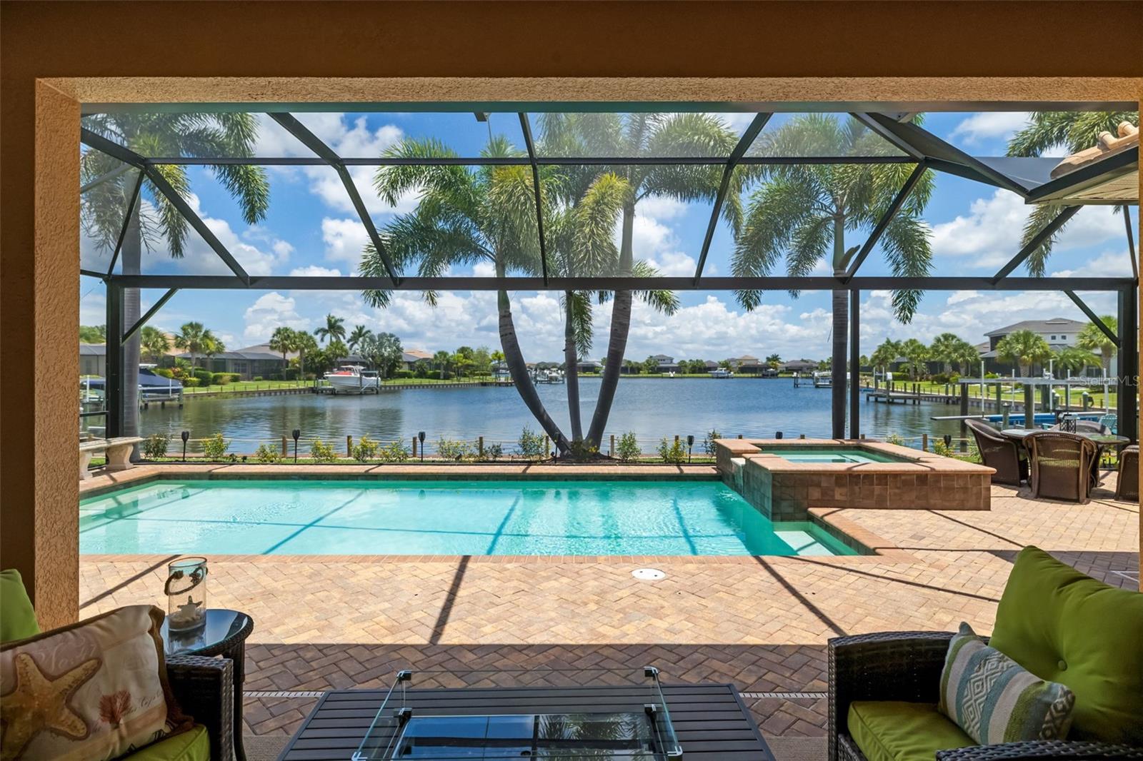 WATERFRONT LUXURY IN TIDEWATER PRESERVE | DIRECT ACCESS TO THE MANATEE RIVER | 3 BEDROOMS + OFFICE/DEN | 4.5 BATHS | HEATED SALTWATER POOL | OUTDOOR KITCHEN | MAINTENANCE-FREE LIVING

Experience elevated Florida living in this stunning waterfront residence located in Tidewater Preserve, one of Bradenton’s premier boating communities with direct access to the Manatee River. Designed to capture peaceful water views and effortless indoor-outdoor living, this beautifully appointed home offers 3 bedrooms plus an office/den, 4.5 baths, and a layout that blends luxury, comfort, and functionality.

From the moment you step inside, you’ll notice the thoughtful architectural details, including crown molding, tray ceilings, and an open-concept design filled with natural light. Expansive sliders open seamlessly to the covered lanai, creating the perfect flow for entertaining and everyday living. The panoramic screened enclosure surrounds a heated saltwater pool, offering a private resort-style setting where you can relax, dine, and enjoy tranquil waterfront views year-round.

The outdoor living space is truly exceptional, featuring a covered lanai, outdoor kitchen, and plenty of room to gather with family and friends. Inside, the spacious primary suite feels like a private retreat with a panoramic window overlooking the water, creating a peaceful backdrop to start and end each day.

Located in a maintenance-free, guard-gated boating community, Tidewater Preserve offers an unmatched waterfront lifestyle with boat slips available for rent, access to the Manatee River, resort-style amenities, and a true sense of coastal luxury. Whether you’re enjoying a quiet morning by the pool, entertaining on the lanai, or heading out for a day on the water, this home delivers the best of Florida living.