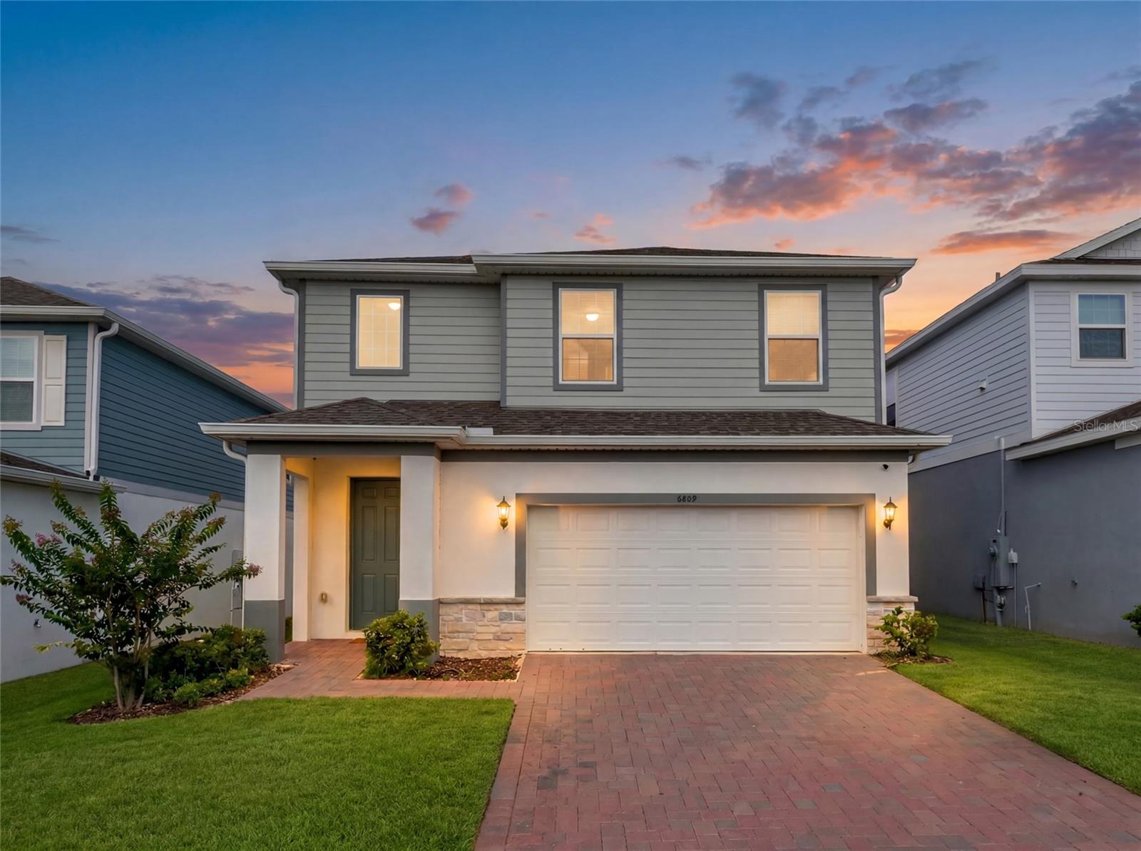 Welcome to the Wekiva, a thoughtfully designed two-story home that perfectly blends style, functionality, and flexibility. This exceptional residence features 5 spacious bedrooms with the optional first-floor guest suite, making it an ideal choice for multigenerational living, extended family, overnight guests, or a private home office.

At the heart of the home, the expansive chef-inspired kitchen overlooks the open-concept family and dining areas, creating the perfect setting for entertaining, holiday gatherings, and everyday living. Large windows and an inviting layout fill the home with natural light while maintaining a warm and welcoming atmosphere.

Upstairs, a generous loft offers endless possibilities as a media room, game room, second living area, or play area. The luxurious owner's suite is designed as a private sanctuary, featuring a spacious walk-in closet and a spa-inspired bathroom with an oversized walk-in shower for a true retreat experience.

Practical features have been thoughtfully incorporated throughout, including a dedicated secure package delivery storage area with exterior access, providing added convenience for online deliveries. A covered front entry creates beautiful curb appeal, while the covered rear lanai extends your living space outdoors, making it perfect for relaxing or entertaining year-round.

Offering an outstanding combination of space, versatility, and modern design, this 5-bedroom home delivers exceptional value for today's buyers. With flexible living areas, premium features, and a layout designed to adapt to your lifestyle, the Wekiva is ready to welcome you home.