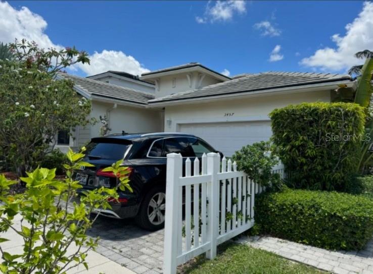 Beautiful lakefront home in the highly desirable Antigua at Oasis community in Homestead. This charming one-story residence offers 3 bedrooms, 2 bathrooms, approximately 1,876 sq ft of living area, and a well-designed floor plan that combines comfort, functionality, and natural light.

Built in 2007 and situated on a 5,000 sq ft lot, the property features serene lake views, ceramic floors, a spacious driveway, and an attached 2-car garage. The interior offers a comfortable layout with a family room, pantry, walk-in closets, and inviting living spaces for everyday enjoyment.

The backyard provides a peaceful setting to relax and enjoy the water views. Located in a well-established community with clubhouse, community pool, exercise room, picnic area, and maintained common areas. Conveniently located near schools, shopping centers, restaurants, parks, and major highways.

Whether purchasing as a primary residence or as a long-term investment, this property offers comfort, stability, and strong lifestyle appeal in Homestead. Buyer to verify all measurements, HOA information, restrictions, zoning, schools, and property details independently.