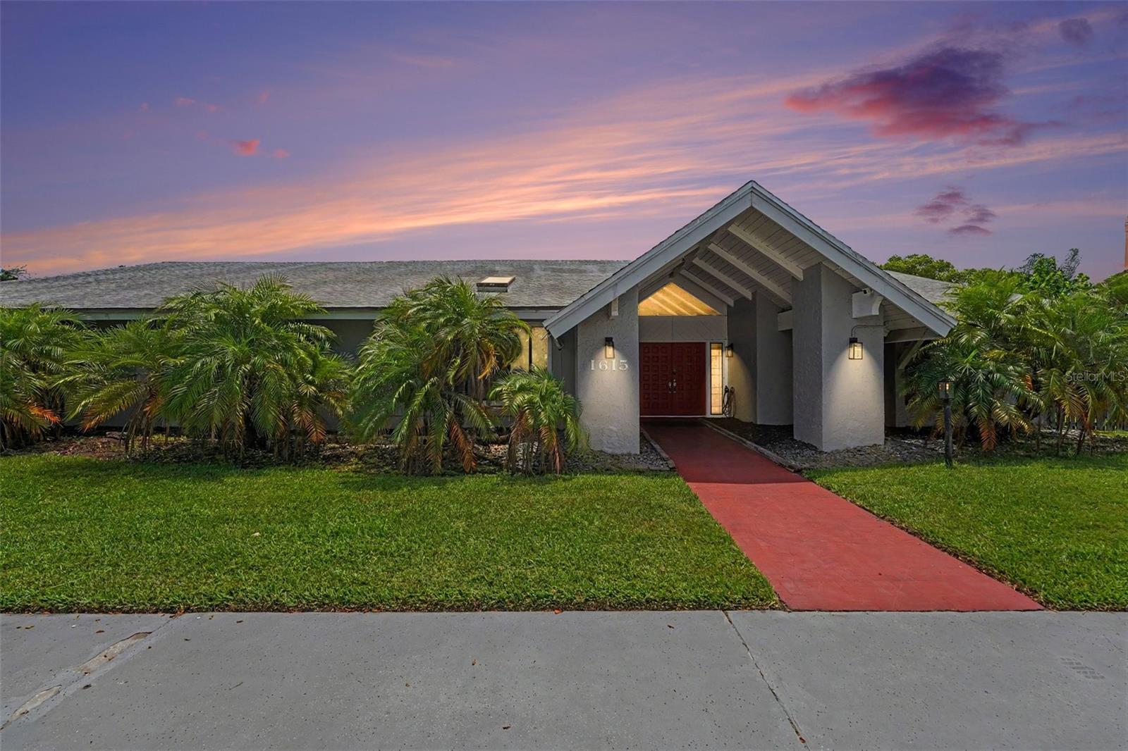 Experience Florida waterfront living in this spacious 4-bedroom pool home offering 4,152 square feet of living space. Located just down the road from St. Paul's School, one of the top-rated schools in the Tampa Bay area, this home combines an exceptional location with outstanding amenities. Designed with both comfort and functionality in mind, the property features a versatile split-bedroom layout, multiple living and entertaining areas, and a private dock overlooking peaceful waterfront views. Priced to sell, this exceptional home is ready for its next owner.

The interior includes formal living and dining rooms, a cozy family room with a wood-burning fireplace, a bright sunroom, and a generously sized kitchen featuring wood cabinetry, granite countertops, and a separate breakfast area. The oversized secondary bedrooms provide plenty of space, while the large laundry room offers built-in cabinetry for added storage. Recently remodeled bathrooms add a fresh, updated touch throughout the home.

Step outside to the expansive screened lanai with an heated pool, creating the perfect setting to relax or entertain while enjoying the waterfront backdrop. A newer seawall and private dock provide direct access to some of Tampa Bay's most sought-after fishing, where Snook, Redfish, Trout, and Tarpon can be caught right from your backyard.

Car enthusiasts, hobbyists, and RV owners will appreciate the impressive 3-car garage plus an oversized RV garage and workshop that adds approximately 2,000 square feet of additional space, measuring approximately 42 feet deep—ideal for oversized vehicles, boats, recreational equipment, or a fully equipped workshop.

Recent improvements include two new split A/C units (2024), a 100-gallon water heater (2025), and a silicone roof coating applied in 2023, providing added value and peace of mind. Combining generous living space, quality updates, exceptional garage capacity, an additional 2,000 square feet of garage/workshop space, a highly desirable location near St. Paul's School, and prime waterfront access, this property is a rare opportunity to own a true Florida retreat.