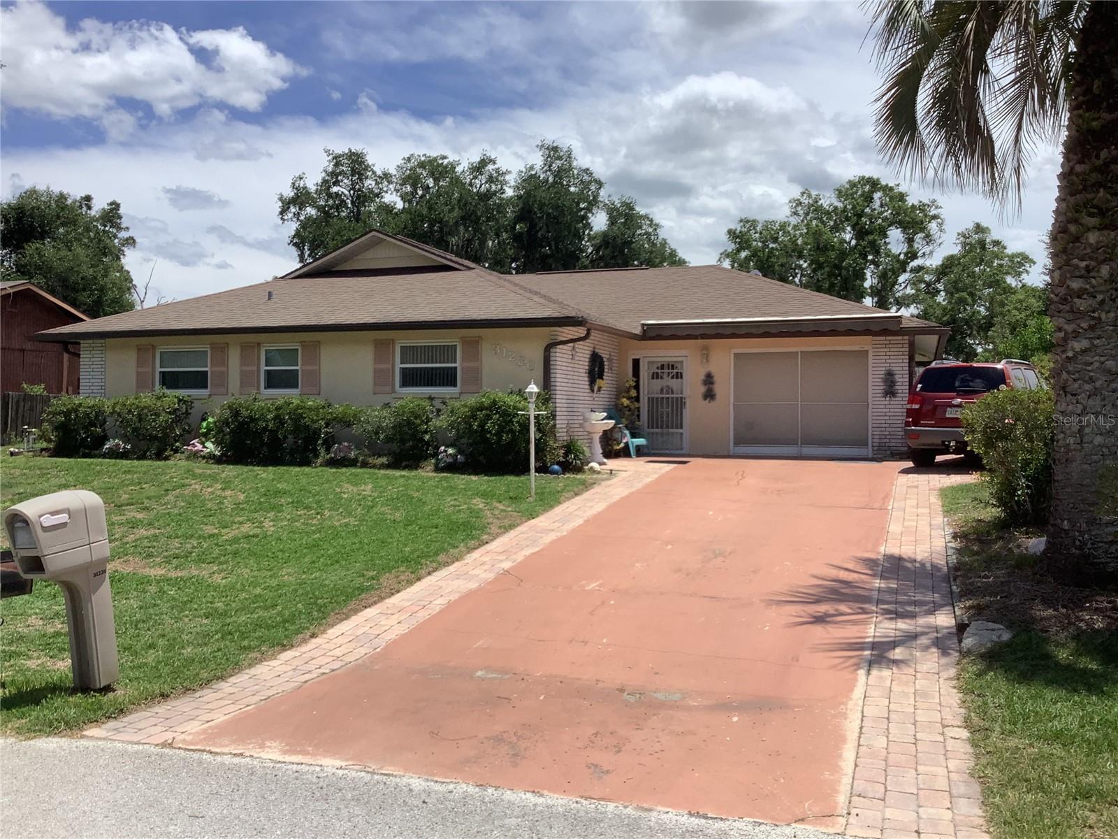 Don't miss this opportunity to own this 3/2  POOL home.  Screened in pool area w/covered patio area.  Perfect for relaxing, entertaining, or enjoying a dip in the pool on those hot summer days.  Step inside to find a large living room with plenty of space for family gatherings and entertaining guest.  The home also offers a formal dining room and a sunny breakfast dinette area, providing dining options for every occasion.  The bedrooms are set up for privacy for family members and guest alike.  Retreat to your spacious primary bedroom and bath  at the end of your busy day.  Owners replaced ac unit approx. 2 years ago.  Roof was just sealed and has a 5 year transferable warranty.  
Pool is solar heated, hot water heater approx. a year old.