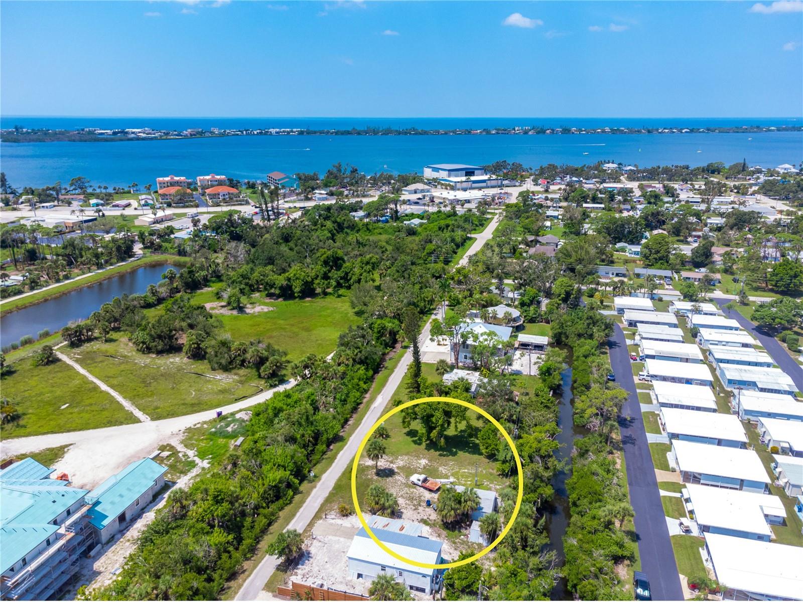 Discover the ultimate coastal lifestyle with this rare, Gulf-access vacant lot, perfectly positioned for your custom home. Located in the heart of Englewood, this property grants you immediate water access via Gottfried Creek, putting you just minutes away from the Intracoastal Waterway and the open Gulf of Mexico. Beyond the water, you are perfectly situated to enjoy the very best of Englewood, including the vibrant local dining, unique shopping, and weekly farmer’s markets on historic Dearborn Street. For the beach lover, you are less than two miles from the pristine, sugar-sand beaches of Manasota Key, making morning strolls and sunset viewings a part of your daily routine. This expansive 75-foot by 120-foot lot offers the perfect foundation for a custom build, providing ample space for a sprawling floor plan and a private dock. With public water, public sewage, and electric already available on-site, this lot is ready for your builder to break ground immediately. Secure your piece of paradise and start designing your future today.