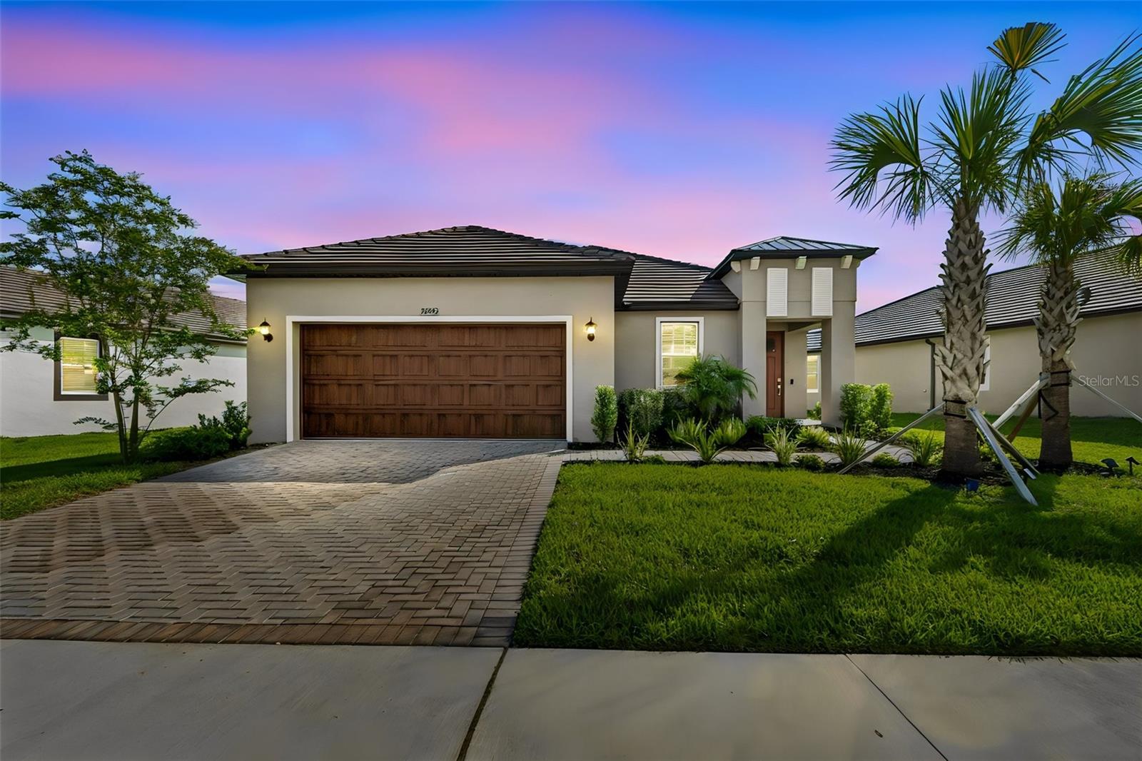 Gorgeous gated turnkey home built in 2025, located in one of the area's most desirable 55+ active adult communities and available for immediate purchase—no need to wait for new construction.

Beautifully maintained this elegant residence offers 2 bedrooms, 2 bathrooms, a versatile flex room currently used as a private office, and 1,783 square feet of well-designed living space. The gourmet kitchen features stainless steel appliances, sleek modern cabinetry, Quartz countertops, and convenient pull-out drawers that maximize storage and functionality.

The Splendor model offers neutral-toned ceramic tile flooring throughout the main living areas, creating an inviting atmosphere. Additional upgrades include ceiling fans in both bedrooms and the living room for year-round comfort, a stylish modern barn door that provides added privacy for the office or flex space, and a professionally finished epoxy-coated garage floor that adds both durability and stylish look.

All appliances convey with the sale, making this truly a move-in-ready home.

From the moment you enter, you’ll notice the pride of ownership! The open-concept floor plan creates a seamless flow that is ideal for everyday living. 

Designed for a low-maintenance lifestyle without sacrificing luxury, this home allows you to spend more time enjoying life and less time on upkeep. HOA fees include lawn care and maintenance, reclaimed water irrigation, basic cable and internet, offering added convenience and value.

Residents enjoy resort-style amenities including a stunning clubhouse, pool, poolside bar, fitness center, elegant ballroom, café-style restaurant, pickleball and tennis courts, and walking trails. A full calendar of social events, clubs, and activities supports an active and connected lifestyle. 

Golf carts are welcome, making it easy to get around the community and enjoy convenient access to the nearby Mirada Lagoon, which features a private resident-only entrance area for relaxation and recreation and is included with your membership.

Whether you’re seeking an active lifestyle, or the perfect place to enjoy your next chapter, this exceptional home offers the ideal blend of luxury, convenience, and community living. Close to grocery stores, shopping centers, restaurants, medical facilities, close access to highways about 40 mins from downtown Tampa, and 1.5 hours from beaches or the Disney Theme parks! Schedule your private tour. Easy to show.
