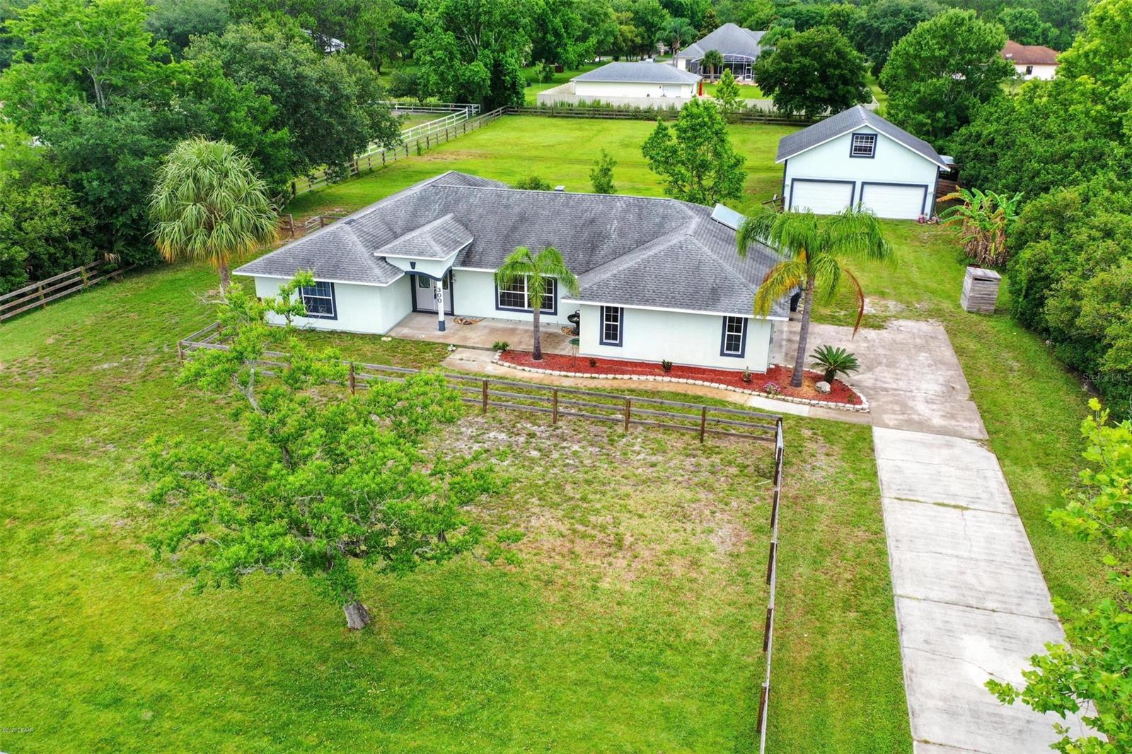 Welcome to your Country Estate where horses are welcome! This ranch style home has been meticulously maintained & offers the serenity that one would expect in the sought after neighborhood called ''Quiet Place in the Country''. The home is all on one floor & sprawls out over 2,232 sq. ft. The kitchen is a chef's dream come true with a prep island, wall oven, tons of granite countertops & plenty of cabinet space. The master is immense & has a large bathroom suite. Both bathrooms have beautiful tile work in the shower and feel like a spa.

You'll enjoy your outside space as well! Recently added 900 sq. ft. garage has plenty of room to park all of your toys, your tools and houses a loft that is perfect for an office, mancave, or potential to easily be finished for a guest suite. Let's also talk about your horse! Wow-the stall gives them plenty of room and not to mention the generous size grooming stall. Nicely kept & fenced in, w/ impressive trees for shade. Solar hot water heater and updated AC makes your energy bills extremely low. Don't forget the horse trails as well all through the area. Take a look at our 3D Tour, it's like already being there! ;Water: City
