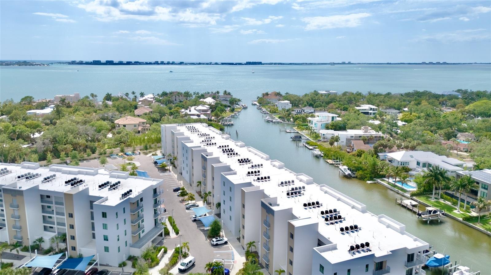 Exceptional opportunity to experience a premier waterfront lifestyle in this contemporary condo, located just minutes from the vibrant energy of downtown Sarasota and our award-winning local beaches. Amazing water views from sunrise to sunset right outside your door.
This gated community offers a suite of high-end amenities, including a state-of-the-art fitness center, a serene pool, and direct water access—perfect for launching a kayak or paddleboard through Whitaker Bayou into Sarasota Bay. A community dog park and fire pit are also available. The residence itself features modern styling with clean lines and is complemented by practical luxuries such as custom designer shades and curtains throughout and a large organized walk in closet in the owners suite. 
Additional  features of this property include:
-Den/Office with built in closet.
- Dedicated underground parking space, additional storage, and secure elevator access.
- A full-size front-load washer and dryer conveniently located adjacent to the owner's suite walk-in closet.
- Significant investment potential, with the rare benefit of permitting weekly rentals.
Whether you are seeking a personal sanctuary or a high-performing income-generating property, this residence is an ideal choice.