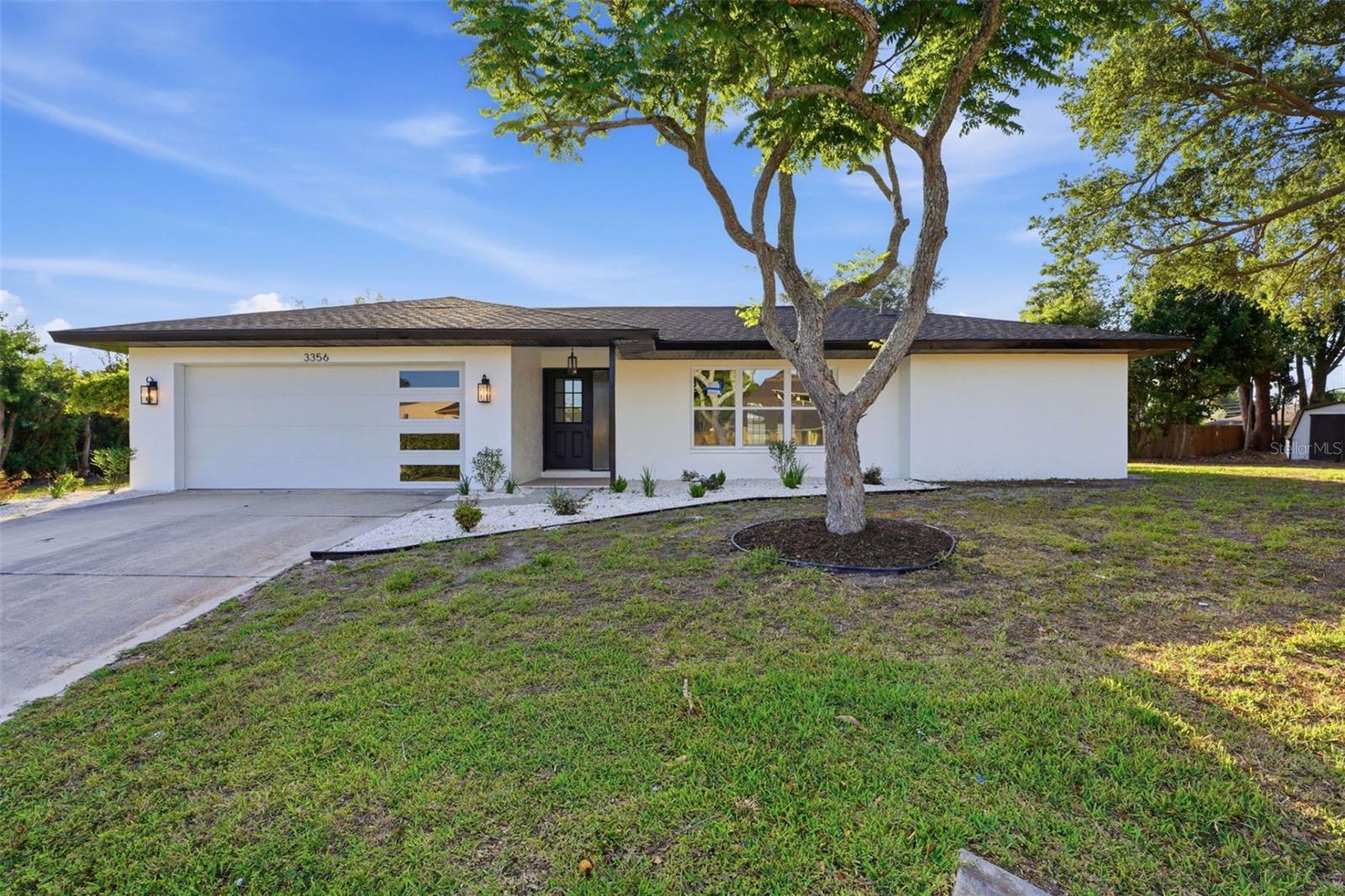 Welcome to 3356 Plantation Place in beautiful Sarasota, Florida! This gorgeous 3-bedroom, 2-bathroom home with a 2-car garage has been completely remodeled from top to bottom with virtually everything brand new. Located in a highly desirable area just minutes from world-famous Siesta Key Beach, this move-in ready home offers modern style, quality craftsmanship, and peace of mind.Step inside to discover an open and inviting floor plan featuring brand new tiled floors throughout, fresh finishes, updated fixtures, and abundant natural light. The stunning remodeled kitchen showcases beautiful cabinetry, upgraded countertops, and modern finishes perfect for entertaining or everyday living. Both bathrooms have been tastefully renovated with stylish upgrades and designer touches.Major improvements include a brand new roof, new garage door, new doors and windows, new electric panel, new receptacles, and updated fixtures throughout the home. Every detail has been thoughtfully completed, making this property truly turnkey.Enjoy living in one of Sarasota’s most sought-after locations close to Siesta Key, shopping, dining, entertainment, parks, and top-rated schools. Whether you are looking for a primary residence, vacation home, or investment opportunity, this home checks all the boxes.This one won’t last long — schedule your private showing today!
