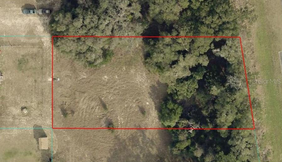 CLEARED - HALF ACRE  - MIXED USE R4 - CORNER LOT FOR SALE IN BELLEVIEW – ENDLESS POSSIBILITIES!

Discover an exceptional investment opportunity in the heart of Belleview with this versatile 0.50-acre corner lot located at the intersection of SE 142nd Place and US Highway 301. Zoned for Mixed Use, this property offers tremendous flexibility, allowing for the construction of a single-family home, manufactured home, or up to a 4-unit residential income property, making it an excellent choice for homeowners, investors, and developers alike.

This desirable parcel is situated on a paved road and features No HOA, giving you the freedom to build and use the property according to your vision. Essential utilities including city water, sewer, and electricity are available at the front of the property, helping simplify the development process and reduce infrastructure costs.

Not located in a flood zone, this lot provides added peace of mind while offering a prime location with convenient access to everyday necessities. Schools, hospitals, grocery stores, restaurants, shopping centers, and major employers are all within easy reach. The property is also just a short drive from Ocala International Airport, making travel and commuting convenient.

Outdoor enthusiasts will appreciate the close proximity to Lake Weir, where boating, fishing, and waterfront recreation await, as well as the natural beauty of the Ocala National Forest, known for its scenic trails, crystal-clear springs, camping, and outdoor adventures.

Whether you're looking to build your forever home, develop rental units, place a manufactured home, or secure a long-term investment in a growing area, this property offers outstanding potential. Conveniently located near the thriving communities of Belleview, Ocala, and The Villages, this is a rare opportunity to own a highly versatile parcel in a rapidly expanding corridor.

Don't miss your chance to invest in the future—schedule a visit today and explore the possibilities this unique property has to provide!