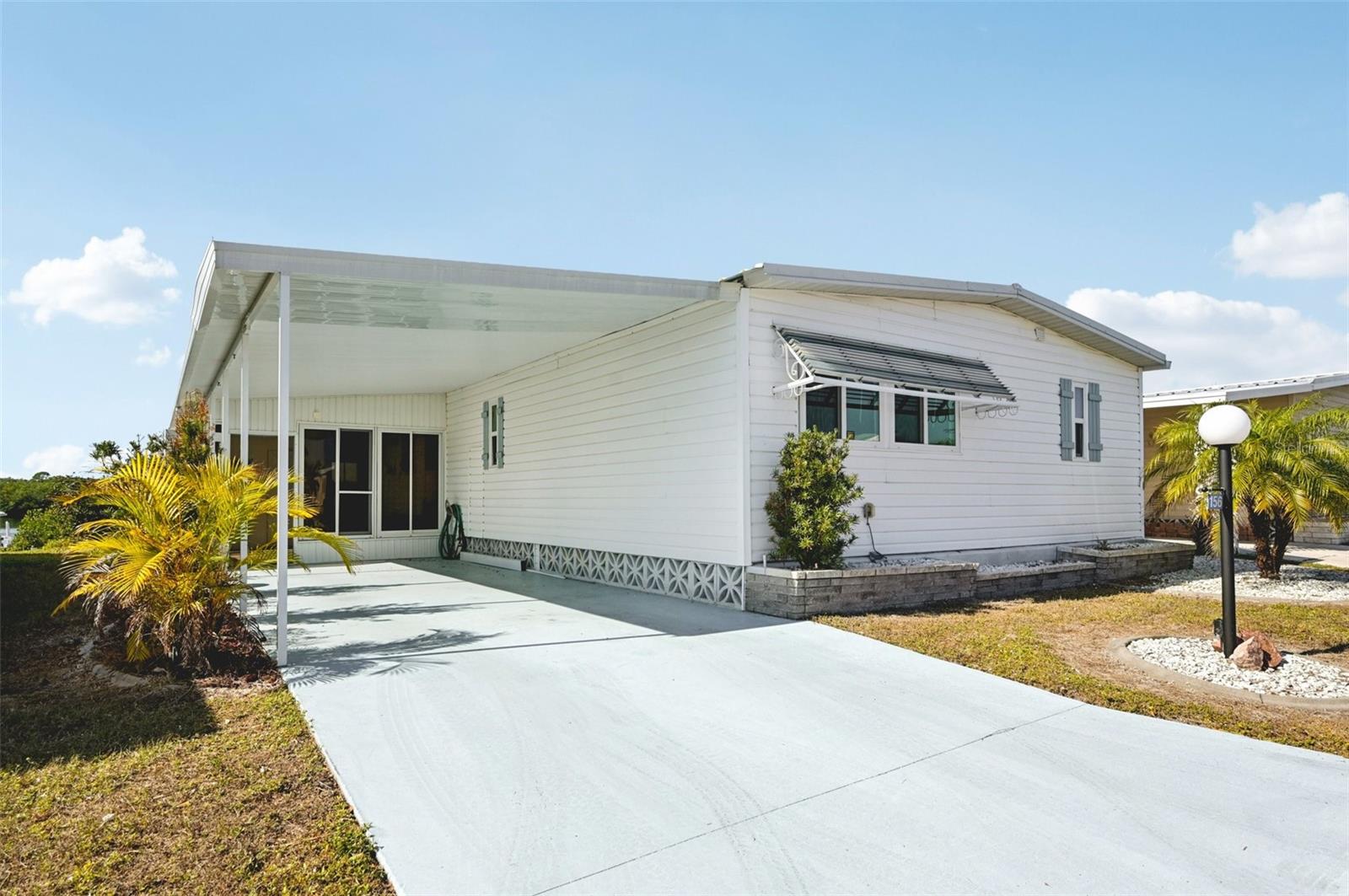 HUGE Price Improvement on the best view in the community!  Discover this stunning 2-bedroom, 2-bathroom fully furnished home boasting 1,372 sq. ft. of elegantly designed living space. Situated on almost 50 feet of prime waterfront property, this home offers direct access to the serene waters, complete with a private dock perfect for fishing, boating, or simply relaxing by the water.  UPGRADES:  Roof 2023, Water heater 1/2020, HVAC 10/2017 and the windows were replaced 2018.
As you step inside, you’ll be greeted by a bright and open floor plan that seamlessly connects the living, dining, and kitchen areas, creating an inviting atmosphere for family gatherings and entertaining guests. The well-appointed kitchen features modern appliances and storage, including built in storage at countertop.
 The two spacious bedrooms provide comfort and tranquility, while the two stylish bathrooms ensure convenience for you and your guests.   Enjoy your morning coffee or sunset views in the extended lanai, which offers additional outdoor living space to bask in the beauty of your surroundings and beautiful water view!  There is a walkway to your own private dock!  
This property in Lazy River is an ideal retreat for those seeking a peaceful lifestyle with the luxury of waterfront living. All you need is your flip flops!  Don’t miss the opportunity to make this beautiful home your own!
