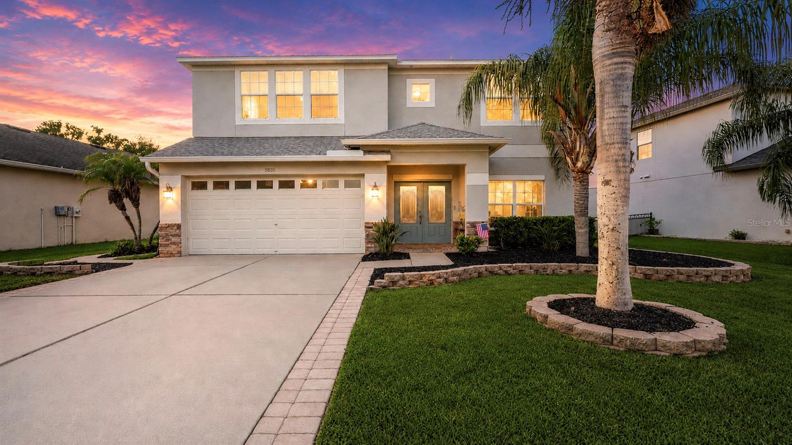 Nestled on a premium preserve homesite within the gated community of Creekside Preserve, this beautifully maintained 5-bedroom, 3-bath residence was designed for both everyday comfort and unforgettable entertaining. NEW water heater (2026) and NEW ROOF (2025) provides peace of mind, while the thoughtfully designed floor plan offers space for everyone, including a first-floor bedroom and full bath that is ideal for guests, extended family, or a private home office.  The true star of the property is the spectacular backyard retreat. In Florida, a pool isn't just an amenity—it's a lifestyle. And this one is extraordinary. Featuring one of the largest residential pools you'll find in Parrish, this heated (year-round enjoyment!) pool and spa creates a private resort experience right in your own backyard. Multiple waterfalls, underwater LED lighting, an expansive paver patio, and an oversized covered lanai combine to create the ultimate gathering space for birthdays, holidays, summer parties, or simply relaxing after a long day. Already plumbed for an outdoor kitchen, the possibilities are endless.  Inside, the spacious kitchen is ready to host everything from holiday dinners to weeknight family meals, featuring beautiful 42-inch hardwood cabinetry, abundant storage, and newer stainless-steel appliances. Upstairs, four additional bedrooms and a versatile loft provide room to grow, while the impressive primary suite offers a peaceful retreat complete with a custom walk-in closet and attached bonus office or flex space.  Surrounded by manicured landscaping, a fenced yard, and serene preserve views, you'll find yourself slowing down, taking a deep breath, and appreciating the simple joys of home. It's easy to picture morning coffee on the lanai, family gatherings around the pool, and creating traditions that will last a lifetime.  With low HOA fees, no CDD fees, and shopping and dining just a golf-cart ride away, you'll enjoy the perfect blend of convenience and relaxation. Plus, easy access to Lakewood Ranch, Sarasota, St. Petersburg, and Tampa makes this location as practical as it is desirable.  If you've been searching for a home where family, friends, and the Florida lifestyle come together in perfect harmony, you've just found it. Welcome home.