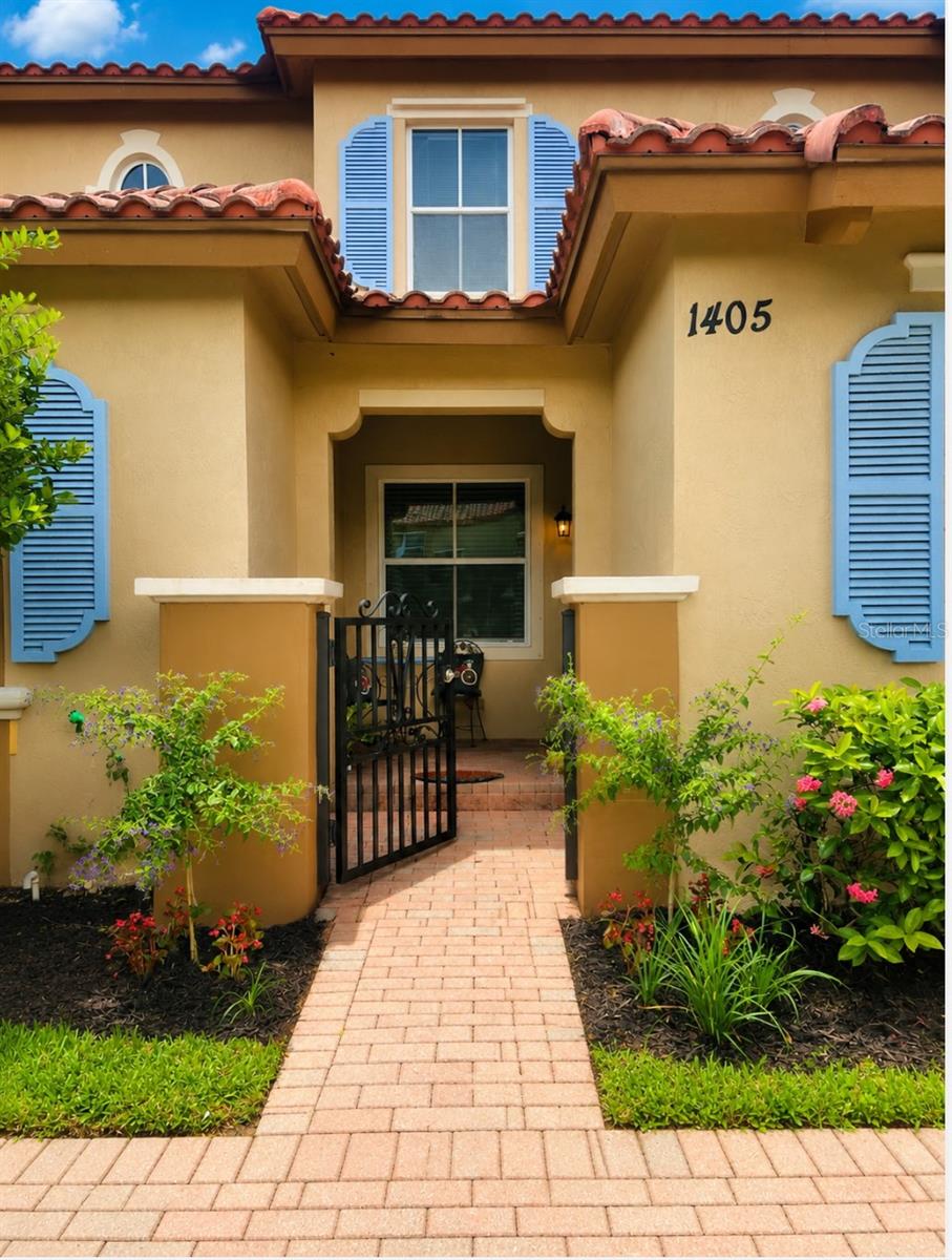 This beautiful Mediterranean style townhome with 3br/3ba with 2 assigned spaces is located in a quiet residential gated community, the Links at Emerald Dunes. Enjoy tile on the first floor and fresh paint throughout. The kitchen boasts stainless-steel appliances, including newer dishwasher (2026) and stove (2025). The upstairs master bedroom has it's own private patio. Community pool and playground areas steps from unit. Enjoy resort style amenities and easy access to the Turnpike and downtown West Palm Beach.