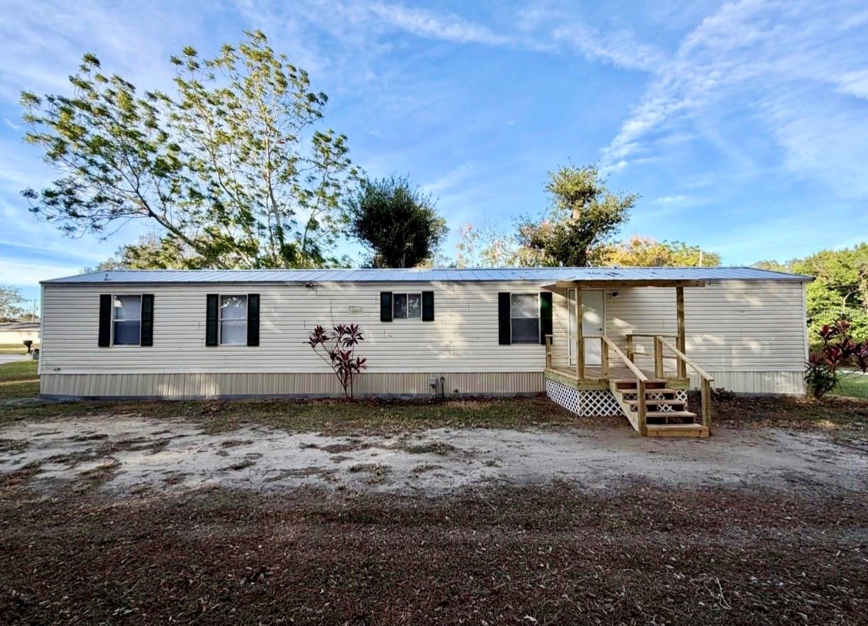 You must see this lovely 2 bedroom 2 bathroom manufactured home located south Lakeland. This remodeled home boasts a new metal roof in 2022, new AC unit in 2022, new flooring, new appliances, a walk in shower, new blinds, new inside paint, and a new porch. The home sits on a large .25 acre cul-de-sac lot. The property is conveniently located to many shopping centers, parks, grocery stores, and the Polk Parkway for easy commutes to Orlando and Tampa. Set up your showing today before it is gone.