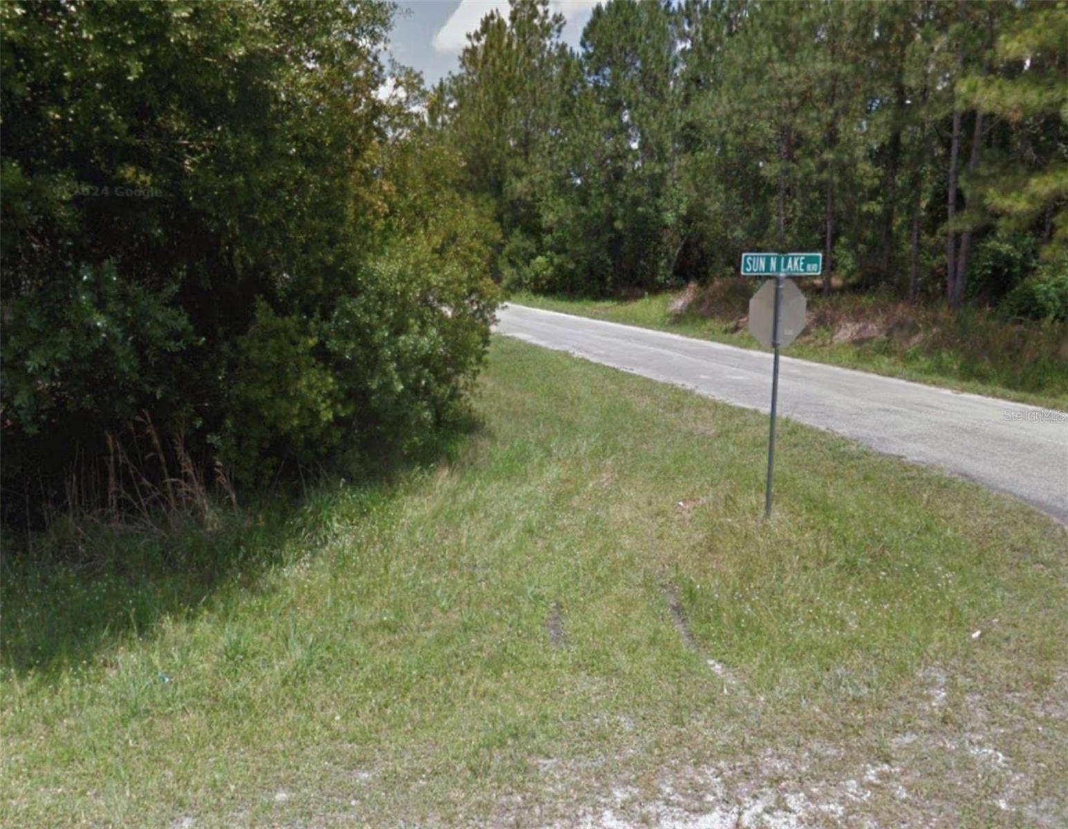 Prime corner lot opportunity in the desirable Sun ’n Lake of Sebring community! This spacious residential lot offers excellent visibility and flexibility for building your dream home or investment property. Located on a paved road with nearby water and electric utilities available (septic required).
Enjoy a convenient location just minutes from the Sebring International Raceway, golf courses, medical centers, schools, shopping, and dining. Sun ’n Lake is a vibrant community offering outstanding amenities including golf courses, clubhouse, parks, and recreational areas.
Take advantage of this corner lot in a growing area surrounded by beautiful lakes and nature while enjoying the relaxed Florida lifestyle year-round.