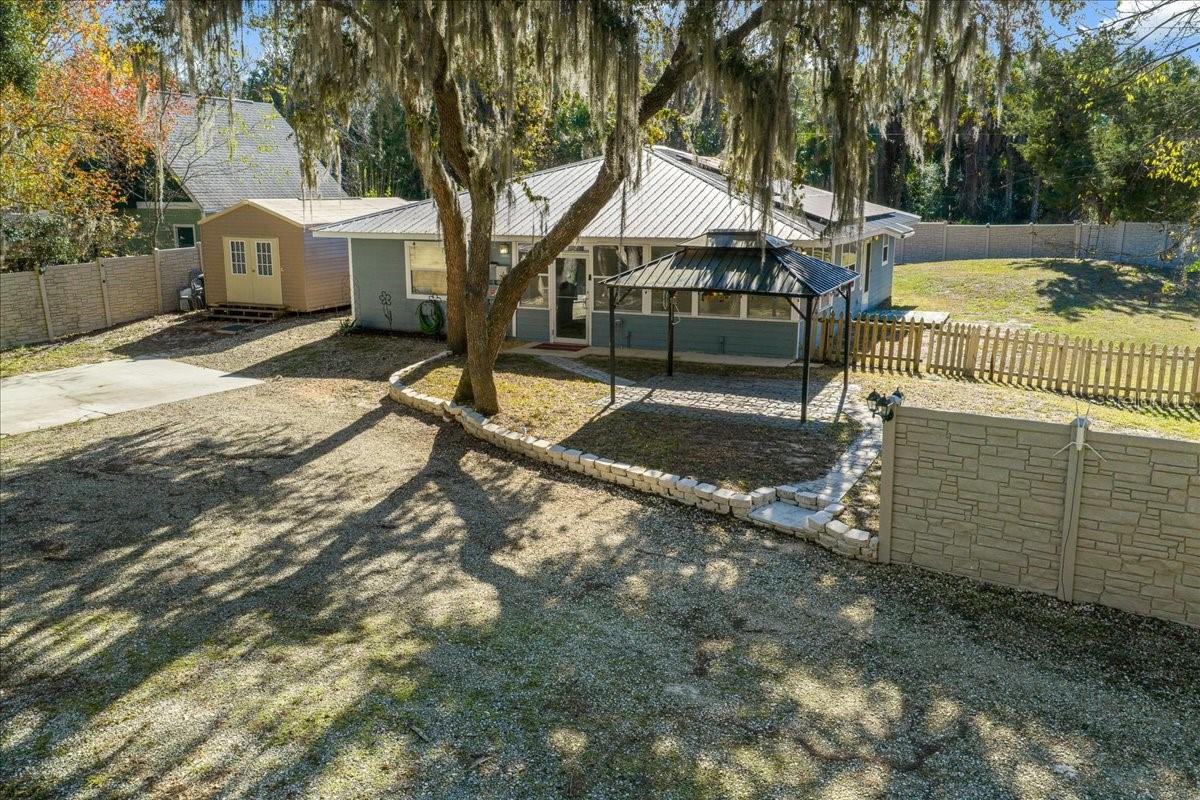 BOAT DOCK & DIRECT GULF ACCESS! You’ve found it—an exceptional riverfront retreat on the Withlacoochee River. This beautifully maintained 2-bedroom, 2-bath home with a versatile flex room offers 1,554 sq. ft. of living space on .83 acres, featuring an inviting open floor plan ideal for both everyday living and entertaining. The home features a spacious, well-appointed kitchen with ample cabinetry, generous counter space, bar area and a functional layout that flows effortlessly into the main living room, perfect for hosting family and friends. New AC just installed inside and out 3/2026. The spacious primary suite includes an en-suite bath and a large walk-in closet. The flex room provides endless possibilities as a home office, workspace, hobby room, or additional sleeping area. Step outside and enjoy your own private oasis overlooking the river. Follow the path to your private boat dock, offering direct Gulf access—ideal for boating, fishing, or kayaking. Additional highlights include a durable metal roof and paid-in-full solar panels for energy efficiency and peace of mind. Two large sheds add incredible functionality: one equipped with power and A/C, perfect for a home office or climate controled storage. A second shed perfect for storing tools, equipment, or recreational toys. Enjoy unmatched privacy with the river bordering one side of the property and state forest on the other. A rare opportunity to own a peaceful waterfront property with space, privacy, and access to Florida’s best outdoor lifestyle. Schedule your showing today! This High and Dry home has never had water inside.