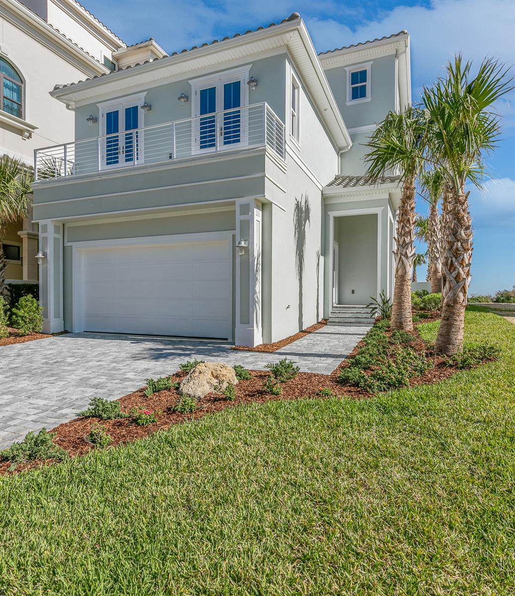 Oceanfront Luxury Meets Golfing Paradise - Your Dream Home Awaits! Welcome to this brand new oceanfront home located in the prestigious Northshore Estates. Just steps from beach access, this stunning property offers expansive views of the ocean and the legendary 18th hole of the Jack Nicklaus Ocean Course. Whether you prefer to enjoy the calming sounds of the waves from your private balcony or take a leisurely stroll to the nearby Hammock Beach Resort to explore its world-class amenities, this home is perfectly positioned to embrace the best of coastal living. Exclusive Resort Living Memberships to Hammock Beach Resort are available (but not mandatory), giving you access to an incredible range of amenities, including golf, tennis, dining, and spa services. It's the ultimate blend of luxury and convenience, right at your doorstep. Gourmet Kitchen & Elegant Living Spaces The heart of this exquisite home is the gourmet kitchen, featuring Mouser Custom Cabinetry and top-of-the-line Viking appliances. An open-concept design, complemented by a linear fireplace, creates a welcoming space for entertaining and relaxation. The butler's pantry and separate wet bar add a touch of sophistication and practicality, making hosting a breeze. Opulent Owner's Retreat Upstairs, you'll discover the owner's retreat-an expansive suite that spans the width of the home. This luxurious space includes a double master bedroom, with enough room for a king bed and seating area, a spacious walk-in closet, and a wet bar for your convenience. Unwind in style with panoramic views of the ocean and golf course right from your personal sanctuary. Indoor-Outdoor Living On the first floor, you'll find a wet bar and family room. Full sliding doors open to a private backyard oasis featuring a pool and spa, perfect for relaxing or entertaining guests while soaking in the beautiful coastal setting. Every detail, from the custom lighting to the open stairwell, has been designed to create a welcoming and refined atmosphere.
Impressive Laundry & Storage Spaces. The home is designed with convenience in mind, featuring a laundry feature on each of the three floors, including a luxurious space with marble floors and countertops on the first level. Your journey begins in the grand foyer, where the custom lighting and expansive stairwell set the tone for the sophisticated style and attention to detail throughout this breathtaking home. Don't miss out on the opportunity to own this slice of paradise, where the beauty of the ocean and the allure of world class golfing are yours to enjoy every day.