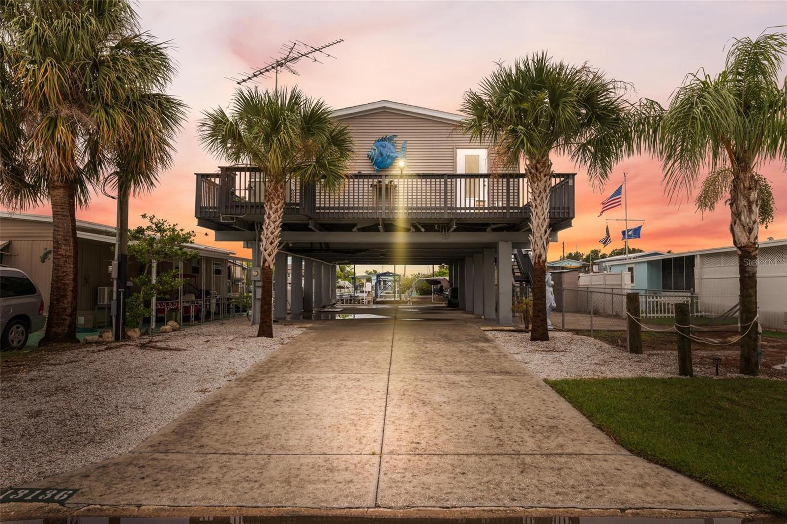 Welcome home to this hidden paradise at 13136 Cabin Court with breathtaking views of the Gulf of Mexico with Sunsets that will bring you tears of joy and spectacular sunrises that will make you wonder why you didn't make this move sooner, but it can now be yours for the rest of your life! This newly remodeled 2003 Palm Harbor home with 2x6 framing and Cat 3 rating is stunning inside, tastefully decorated with no costs spared on upgrades with a large open gourmet kitchen with granite counter tops, under cabinet lighting, all stainless-steel appliances and even a double oven; this kitchen will delight every culinary enthusiast especially when you see that wine cooler just waiting for you! The spacious master suite with walk-in closet built-ins, ensuite bath with a large tub, dual sinks, and large separate shower makes this an oasis that beckons you to come in. Worried about being without power when you live in Florida? You won't here!! The entire home is connected to a Generac which means the longest you go without power is literally seconds before this system automatically kicks in!! The exterior Antenna allows you to get 80 free channels! The Views from this Stilt home are absolutely breathtaking, you can even see the Redneck Riveria at the mouth of the Gulf of Mexico from here!! You will never need to be concerned about carrying groceries up all those stairs thanks to the new Cargo Lift with a 1500lb capacity. This property also boasts a 12,500lb Boat Lift and large floating dock with underwater lights that allow you to see the marine life from a whole new perspective! A new 2020 BEE roof, and palm trees lining the driveway making the entrance to this home truly Floridian. The owners calls this home 'Crabbin Court' because of the amount of stone crabs they caught right off their seawall this year!! The entire home has hurricane shutters and it comes fully furnished (minus seller personal items), with a Golf Cart, Kayaks, bicycles and more! This low maintenance home is perfect for someone looking to live the BIG life without the BIG price tag. It has a fenced area for your pet, with a great workshop area under the home with multiple storage sheds giving ample storage space and covered parking area that can easily fit 4 vehicles. This property is located on a wide and deep canal on the Gulf of Mexico that offers some of the best sailing and inshore/offshore fishing on the West Coast!! In addition, you are only minutes away from the Werner-Boyce Salt Springs State Park that you can get to on your kayak, jet ski, or flat bottom boat. Hudson Beach is only 5 minutes away with Sam’s Beach Bar, Ollies, Inn on the Gulf, and Get Hooked restaurants serving amazing food and entertainment! Tampa International Airport is less than an hour away, as is Honeymoon Island Beach and Clearwater Beach. This home is in a community called ‘Signal Cove’ where you own the property your home is on. No HOA’s or Deed Restrictions and Golf Cart friendly with Craft Life Brewery on Tower Drive famous for its beer, entertainment, incredible food trucks and talented vendors! Easy access to famous beaches, amazing restaurants, shopping, and healthcare facilities making it a Golden Opportunity for those seeking a Peaceful and Tranquil piece of Paradise! Come and check this out because it won’t last long!! Buyer and their agent to verify all measurements.