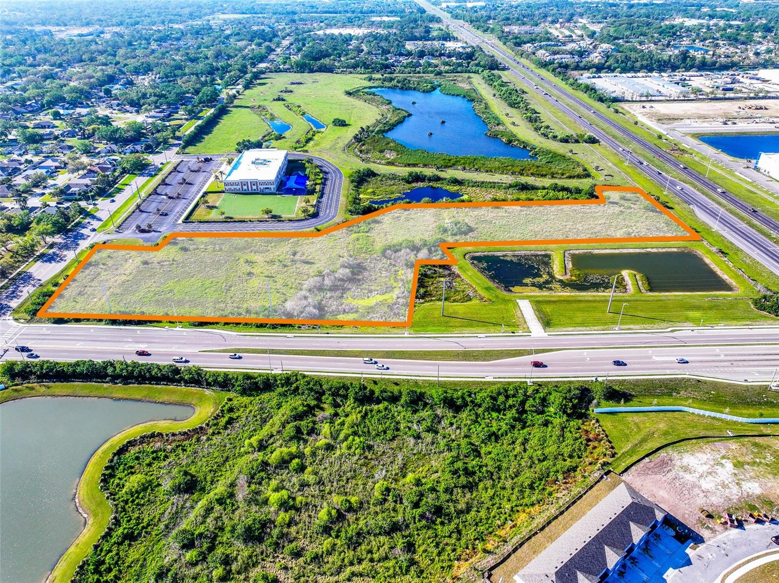 This exceptional 8.2 +/- acre site offers a dual hard corner location with exceptional visibility and accessibility. Featuring frontage on US-301, 44th Avenue East, and 30th Street East, this property benefits from a combined traffic count of 46,600 cars per day, ensuring maximum exposure for future development.

Recently rezoned to Planned Development Mixed-Use (PD-MU), this site allows for a wide range of development options, making it an ideal investment for commercial, retail, or mixed-use projects. A Final Site Plan has been approved for 109,500 SF Self-Storage facility plus another 40,000 SF with Preliminary Site Plan approval for Phase II. 

Nearby Industrial area is home to a number of large corporate employers such as Bealls, Tropicana, Pierce Manufacturing, and Team Edition Apparel, among others. This prime location provides strong demand drivers for a variety of commercial and retail uses.

With a rezone, the property’s RES-9 Future Land Use would allow a developer to propose up to 9 dwelling units per acre (DU/AC) or up to 20 DU/AC with a density bonus for a Mixed-Use or Affordable Housing project.