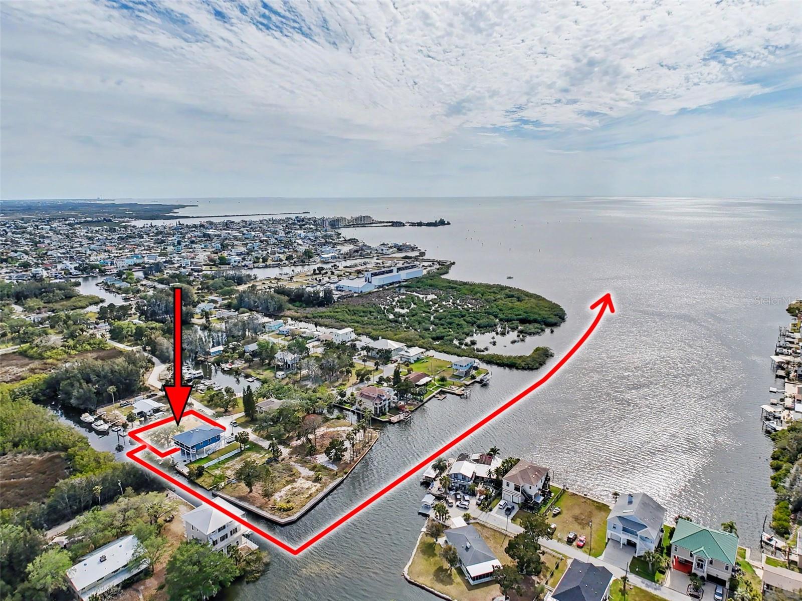 One or more photo(s) has been virtually staged. This FENCED-IN WATYERFRONT LOT is located in the PINE ISLAND ESTATES SUBDIVISION featuring a PRIVATE BOAT RAMP, 90 foot of CONCRETE SEAWALL, a 10 x 16ft STATIONARY DOCK, a CONCRETE PARKING PAD and NO REAR NEIGHBORS across the canal. There is ELECTRIC on site (NEEDS  METER) and a WATER HOOK up just in front of the fence. The PORT HUDSON MARINA and GET HOOKED RESTAURANT are in walking distance. Other local restaurants like Inn on the Gul and Sam's Beach Bar are a 5-minute drive. Sunwest Park is a local tourist waterfront attraction that is nearby as well. The Bayonet Point Hospital and many local supermarkets are all located right here in Hudson, Florida. The Tampa Bay Airport, Tampa Bay, Clearwater Beach, Homosassa Springs, Tarpon Springs, Pine Island, Honeymoon Island and Weeki Wachee are all under an hour away. Build your DREAM HOME and start enjoying the FLORIDA LIFESTYLE. Fish & crab off your own dock or take a kayak, jet ski or boat ride (passing Manatees and Dolphins along the way) to the GULF OF AMERICA where the fish are plentiful, the fun is never-ending and the sunsets are always awesome!