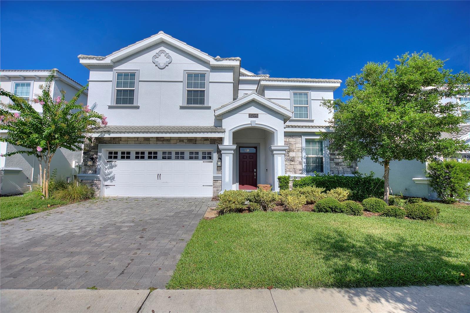 Welcome to 1594 Sandbagger Drive in the prestigious ChampionsGate Resort Community, a spectacular fully furnished 8-bedroom, 5-bathroom vacation home designed for luxury living and exceptional rental performance. Built in 2018 and spanning approximately 3,909 square feet, this turnkey property showcases custom upgrades, including professionally themed bedrooms, a private movie theater, and a converted game room that create an unforgettable guest experience.The spacious open-concept floor plan features an upgraded kitchen with quartz countertops, stainless steel appliances, and generous living and dining areas that seamlessly flow to the screened lanai. Outside, guests can enjoy a private heated pool and spa, creating the perfect setting for relaxation after a day at Central Florida’s world-famous attractions.
Located within the highly sought-after ChampionsGate Resort, owners and guests enjoy access to resort-style amenities including a lazy river, water slides, fitness center, tennis courts, clubhouse, restaurant, and golf facilities. Just minutes from Walt Disney World, Universal Orlando, shopping, dining, and major highways, this home offers the ideal combination of lifestyle and investment potential. Whether you're seeking a luxury vacation retreat, a high-performing short-term rental, or both, 1594 Sandbagger Drive presents a rare opportunity to own one of ChampionsGate’s most impressive and income-producing properties.