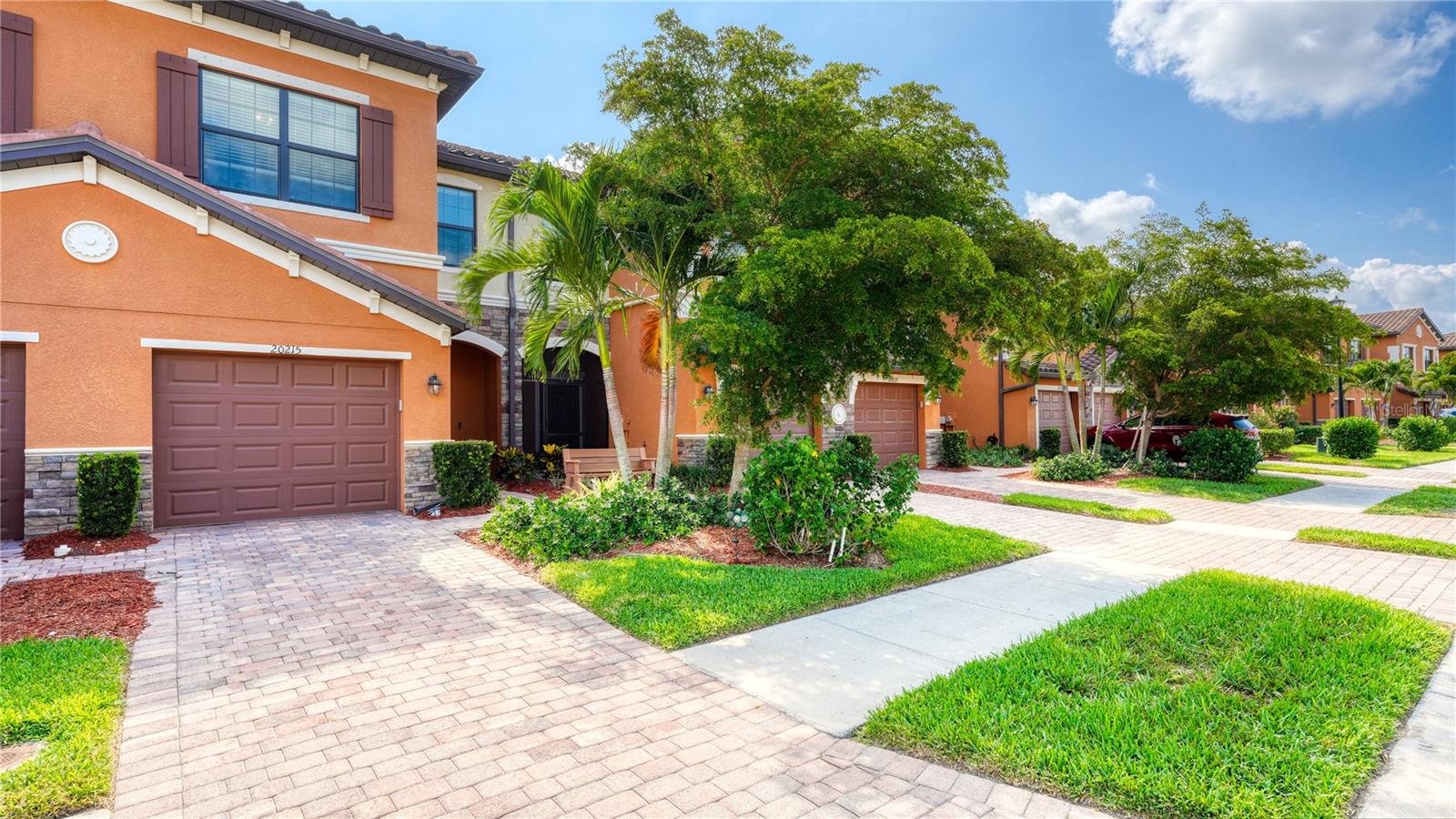 Welcome to paradise at Gran Paradiso; the townhouse is very close to the new Downtown Wellen Park.   The open concept on the first floor offers porcelain tiled flooring throughout, a spacious kitchen, pantry, dining and living area with a half bathroom.  Step outside and enjoy the sunrise on the screened-in lanai.  The association has approved owners to extend their patio space for extra outdoor square footage.  Upstairs you will find generous sized bedrooms, laundry and 2 full bathrooms.  Grand Paradiso has numerous amenities including a beautiful resort style pool, tennis, pickle ball, fitness center, and a community clubhouse.  There is an activity director who organizes various events for homeowners as well. The townhouse is being offered turnkey furnished except for items in the garage, and the TV and stand in the living room and jewelry armoire in the bedroom.