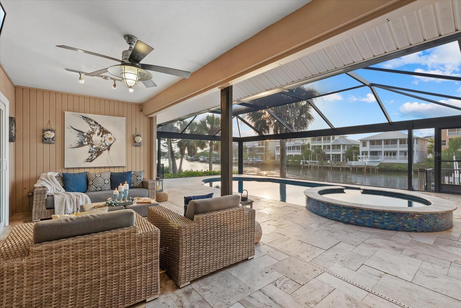 DOCK AND 16,000 LB BOAT LIFT! GULF ACCESS! PRIVATE SALTWATER POOL! IMPACT GLASS! HIGH ELEVATION! NEW SEPTIC SYSTEM in process and the deposit is paid. Experience the Florida lifestyle of coastal living at 1461 Marlin St, Nokomis - an elevated and updated waterfront retreat boasting over $300,000 of Seller improvements. This home is ELEVATED at more than 11 feet, keeping it high and dry and solid through storm season with zero flooding over the years. HIGHLIGHTS include: HVAC with 9 years remaining warranty (parts & labor), water heater, pool equipment with WIFI automation (2024); hurricane IMPACT WINDOWS AND DOORS, new garage door, new pool cage with panoramic screens, home RE-PIPED and UPDATED BATHROOM (2018); METAL ROOF with one year remaining warranty, pool resurfaced and new travertine pool deck (2017) – the list goes on!  Perfectly positioned at the end of a tranquil cul-de-sac, with over a 1/3 of an acre, this Nokomis residence offers an extraordinary blend of sophistication, privacy, and true Gulf-access living along the serene waters of Shakett Creek. Step inside this waterfront 3-bedroom, split floor plan home to discover water views and a bright interior adorned with tile flooring, plantation shutters, and HURRICANE IMPACT GLASS throughout. Every detail has been thoughtfully elevated, including beautifully renovated bathrooms, one of which offers effortless pool access to complement the home’s indoor-outdoor lifestyle. The primary bedroom features water views with sliding glass doors for pool access, large walk-in closet with custom shelving, updated primary bathroom with dual vanities, updated shower with a separate soaking tub and a private water closet. The guest bedroom positioned at the rear of the home also features sliding glass doors for pool access and sunset water views!  The updated guest bathroom is complete with easy pool access! Your private outdoor sanctuary rivals a luxury resort—featuring a NEWER pool cage with panoramic screens to enjoy unobstructed water and sunset views, NEWER travertine tiled pool deck, recently resurfaced sparkling solar HEATED POOL with back up SPA heater, and a dock with a 16,000-lb boat lift.  Whether you’re relaxing poolside, cruising to the Gulf, launching your paddleboard or kayak, casting a line from your dock or savoring quiet water views, this waterfront setting is unmatched. While the home is on public water, there is a private well for all your irrigation needs. Ideally located near Nokomis Beach, downtown Venice, Venice Beach, Sarasota Memorial Hospital, with easy I-75 access, this GULF ACCESS home offers both exclusivity and unbeatable convenience. With its extensive updates, premier waterfront access, and ELEVATED construction, this exceptional residence delivers a rare opportunity to own a true coastal haven.