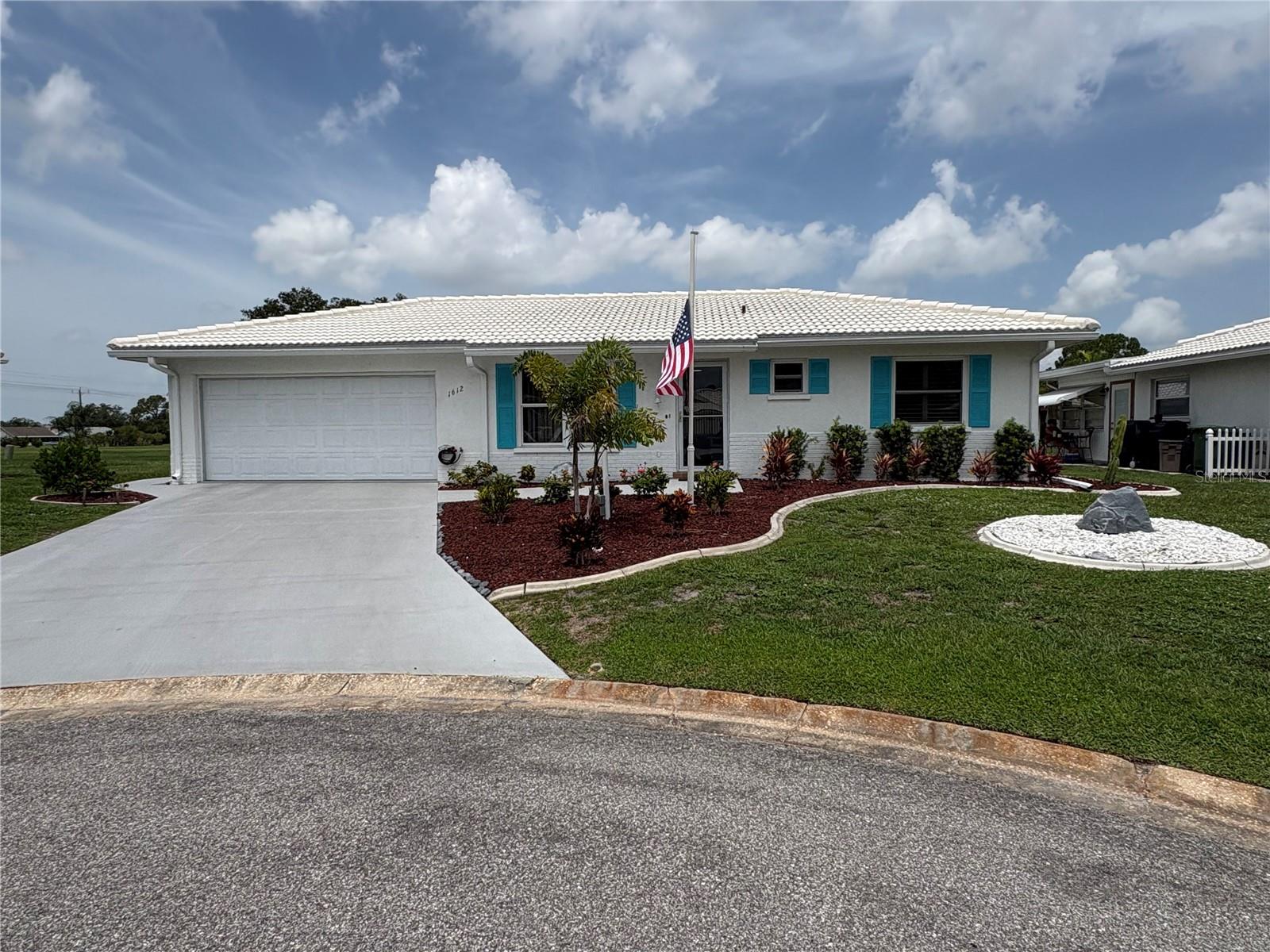 "IT'S 5 O'CLOCK SOMEWHERE AND THAT SOMEWHERE IS AT 1612 S ELMWOOD DR BRADENTON,FL 34208." This beautifully well maintained home located off the 5th hole on River Isles Golf Course located in a 55+ community called River Isles. The home sits on a quiet cul-de-sac at the very back of the community. This 2 bd/ 2ba Ranch Style Home is concrete block with a tile roof and a double stall Garage attached, 16" tiles are throughout the common areas with a open floor lay out and plenty of light all thru the home. The master bedroom is spacious with his and her closets, the wall mounted TV conveys with the sale. Also included in the sale are the Murphy Bed in the spare room, the wall cabinet in the nook area, the 2 cabinets in the dining area plus all the cabinets in the garage. The golf cart and a list of furniture are also available for purchase on a separate contract.