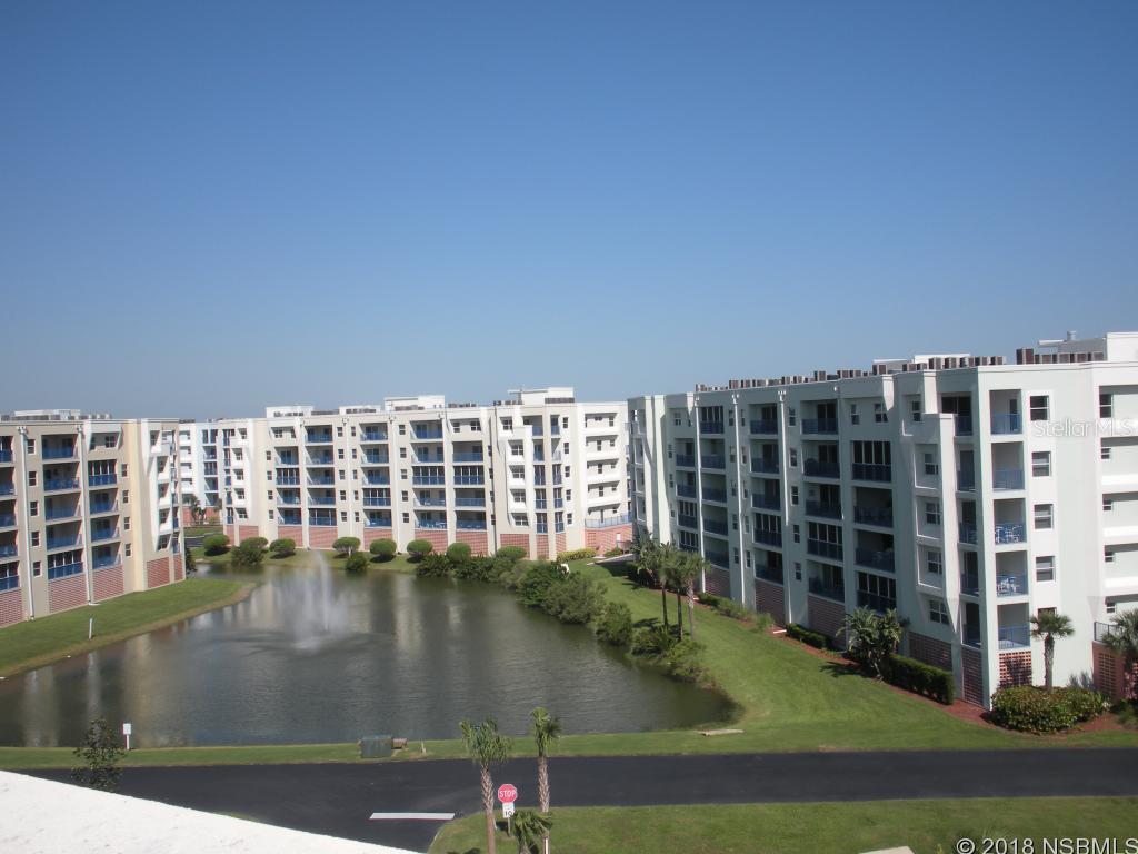 DON'T MISS THIS ONE This unit has been totally renovated.Hard wood flooring in great room and both bedrooms.  New Travertine Tile and both bathrooms and kitchen.  Stainless appliances and granite in kitchen. Master bedroom walk-in California closet.  Custom lighting throughout.  Tiled balcony with electric powered screen overlooking estuary. Buy it for a vacation home or live in it year round. Ocean Walk has 2 pools, gym, media room, tennis, basketball, and much more. ;LocationDescription: Condo ;Water: City