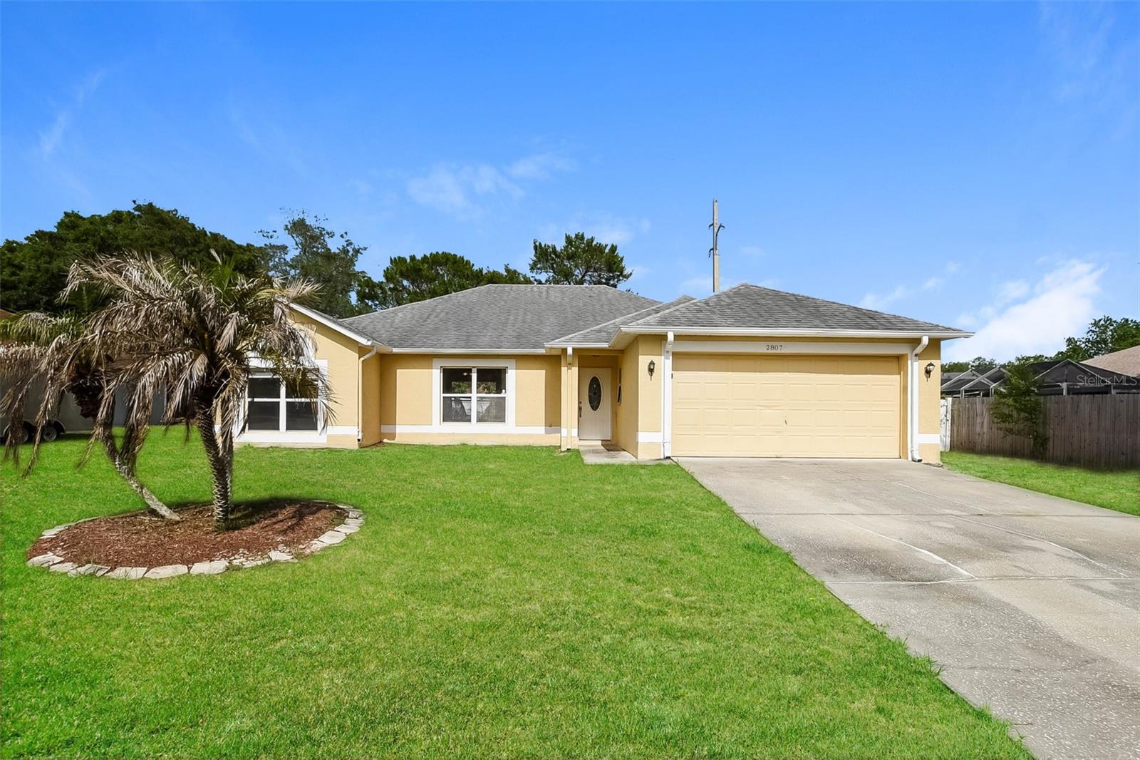 Charm and curb appeal abound for this Deltona home! Step inside into the inviting foyer, through the living and dining rooms, and into the kitchen, which boasts stainless steel appliances, hard surface countertops, and ample storage. This ranch style floorplan is rounded out by a well-appointed secondary family room, the primary suite, and two secondary bedrooms. Come and see for yourself the possibilities that this home has to offer!
