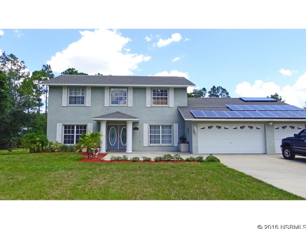 Country estate! Gorgeous one owner custom home on almost 4 acres. This 5BR 3.5BA home is well planned for that large family, or for all the guests to have their privacy.  Formal LR (now used as office), formal DR plus den with FP opening to kitchen. Ground floor MBR is very elegant. Huge 3 car garage for more toys. Water treatment filter and salt system for the well, with hand pump in case of power outage. Solar panels on the roof can be expanded and saves money on electricity. (The solar panels ran the house after Matthew when the rest of the power was out for days!) The 2013 water heater uses solar, backed up by electricity.  The back yard is much bigger than it looks going into the trees on both west and north sides. So much room for horses, to play, for a pool, to park boats, RV, etc. 3-200 Amp power boxes for anything you can think of. Very well maintained and just waiting for you to move in!  Acreage calculated using measurements in metes and bounds legal description.