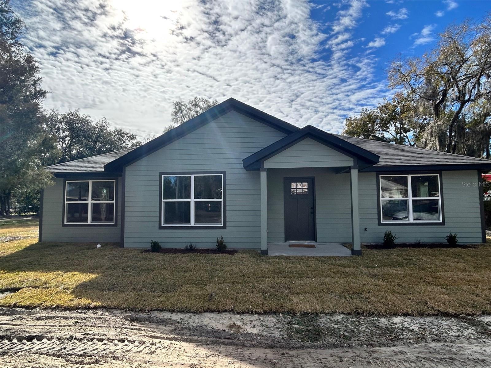 Price Improvement! Brand-new construction located within the city limits of Lake Butler, Florida.  This thoughtfully designed home offers modern finishes and quality craftsmanship throughout.  The kitchen and bathrooms feature granite countertops, providing both style and durability.  Laminate flooring runs throughout offering a clean, contemporary look with easy maintenance.  
Relax and unwind on the covered porches accented with beautiful tongue-and-groove wood ceilings, adding warmth and timeless character to the exterior.  
This home combines modern construction with classic details and is conveniently located near local schools and dining.  A great opportunity to own a new home in a quiet North Florida community.