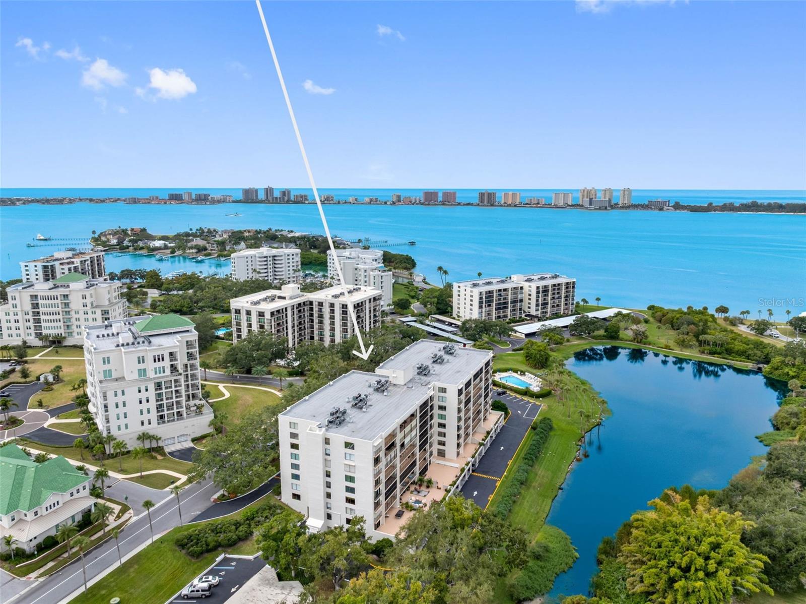 BRAND NEW BEAUTIFULLY REMODELED 2 Bed 2 Bath condo in the exclusive guard gated Belleview Biltmore community in Belleair Florida.  Welcome to this inviting and attractive 1385 SF condo offering south facing abundant light, gorgeous finishes and luxury vinyl plank throughout. Completely remodeled kitchen with quartz, subway backsplash, white wood cabinets, hardware, fixtures and stainless appliances. Living room & dining room are oversized with plenty of room to entertain. King Size Primary Ensuite offers dual closets and ensuite bath that has been completely remodeled with quartz, white cabinetry, and stylish fixtures.  2nd bedroom is perfect for guests or use as your office. 2nd Bath is stunning with tiled walk-in shower, white cabinetry, quartz, and sparkling fixtures.  Balcony access from all rooms to a south facing 26 foot balcony with glorious green tree views. Convenient laundry closet inside unit with hookups. This beautiful condo comes with 1 assigned carport parking and 1 assigned storage under building. Bayshore II building is meticulously maintained with a secure lobby, video monitoring, a heated/cooled lakeside pool, a BBQ area, a clubroom, and bike storage all on Harold’s Lake with a peaceful nature setting offering sights to behold, such as the Rosette Spoonbills. Located in the 24/7 guard gated Belleair Country Club, Belleview Biltmore, and Belleview Inn community. New owner qualifies to skip the multi-year wait list for golf membership application to private Belleair Country club for a fee, should you choose. Wow! What a perk! Private Marina with boat slips for rent or purchase are subject to availability. The Town of Belleair has its own police department, town hall, 19 green space parks, and a recreational center with activities for all.  Close to Gulf beaches, Pinellas Trail, excellent medical facilities, dining and shopping. Two international airports, PIE is 20 mins and TPA is 30 mins. If you are looking for a brand new remodeled unit in this sought after community, this is it! Floor plan photo slide 47 No pets allowed. Must own 2 years before renting.