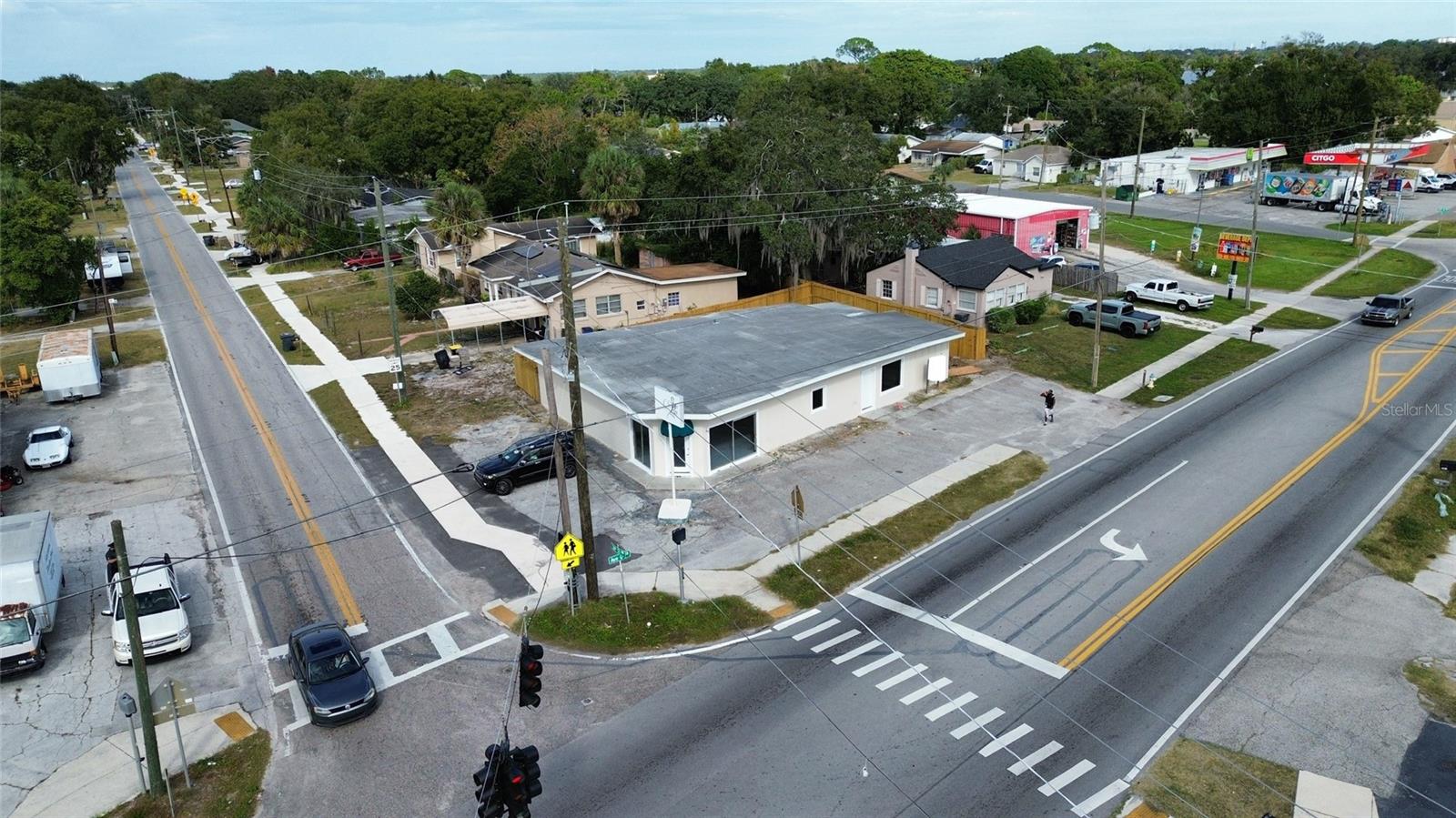 Prime Corner Commercial Building in Winter Haven! This versatile 3,000+ sq ft commercial building offers exceptional visibility and flexibility
fora wide range of business uses. Situated on a prominent corner lot, the property features a tall pole sign for maximum street exposure and an
inviting front awning that enhances curb appeal. Inside, the building offers over 2,000 sq ft of open customer-facing space, ideal for retail,
showroom, office, studio, or service-based operations. The additional 1,000+ sq ft storage/workroom provides ample room for inventory,
production, equipment, or back-office functions—perfect for businesses needing a functional blend of public and private areas. The exterior
includes a large parking lot with 12+ spaces, ensuring convenient access for customers and staff, along with a wood privacy fence surrounding
the rear of the property. Offering high visibility, strong traffic presence, and flexible interior space, this property is an exceptional opportunity for
any business looking to grow in Winter Haven.