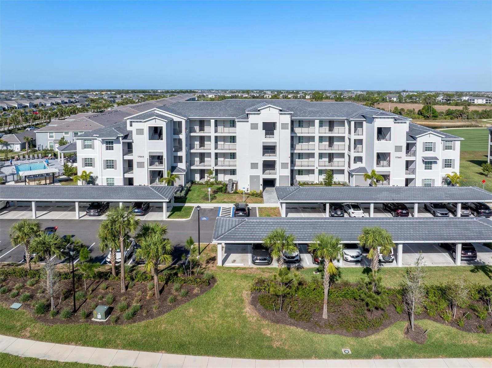 Virtually Staged. Live the lifestyle you deserve in the highly desirable Wellen Park Golf & Country Club, where your GOLF MEMBERSHIP IS INCLUDED and every day feels like a resort vacation. This second-floor, END-UNIT condo, built in 2024, offers the perfect blend of comfort, natural light, and easy Florida living. Enjoy a cold beverage on your screened lanai and take in the breathtaking sunset overlooking a panoramic view of the 5th hole.
This spacious Carolina Model features 3 bedrooms and 2 baths, with the added privacy and brightness that comes with an end unit. The open-concept living spaces make it easy to gather with friends after a round of golf, while the comfortable layout offers plenty of room for visiting guests or a home office. Located just steps from two satellite pools, you can enjoy a refreshing swim or unwind in the sunshine only steps away from your front door. 
Life at Wellen Park Golf & Country Club is all about resort-style living and an active social calendar. Residents enjoy bundled golf on an 18-hole well-maintained course, perfect for morning tee times, afternoon rounds with neighbors, or simply taking in the beautiful fairway views. Beyond golf, the community offers a vibrant lifestyle with a resort-style pool, tiki bar, fitness center, tennis, pickleball, bocce, dog park and a full calendar of social events designed to bring neighbors together. The brand-new clubhouse is under construction and expected to be completed in early 2027.
Located within Wellen Park, one of the fastest-selling master-planned communities in the country, residents also enjoy easy access to Downtown Wellen with its restaurants, shops, lakeside events, and entertainment, plus convenient proximity to Venice beaches, boating, and the Gulf Coast’s famous sunsets.
Whether you're looking for a seasonal golf retreat, investment opportunity, or full-time Florida lifestyle, this nearly new terrace condo offers the chance to enjoy maintenance-free living, resort amenities, and the vibrant golf community buyers are searching for.