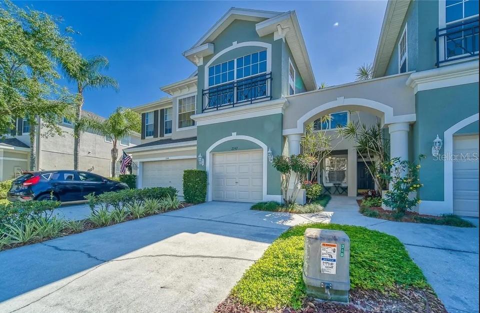 Welcome to the gem of gated communities featuring Huntington Ridge, the ultimate in maintenance-free living in Land O Lakes! This stunning 3 bedroom, 2 1/2 bathroom townhome boasts 1,806 square feet, garage and a fully remodeled first floor. It is the perfect place to call home. Step inside the front door and you'll be wowed by the gorgeous wood floors that run throughout the entire first floor. The newly upgraded kitchen (2021) is a cook's dream, featuring stainless steel appliances, solid stone granite counter tops, tiled backsplash, and a deep kitchen sink with modern fixtures. The kitchen extends into the hallway, opening up to the dining and living rooms in a seamless, open-concept layout. From there, step out onto the enclosed lanai and take in the breathtaking view of lush landscaping, trees, and the peace and privacy of no back yard neighbors. Upstairs, you'll find all the private living space you could ask for, with the owner's bedroom and modern bathroom ensuite. Enjoy many mornings on your second story balcony off of your bedroom. You're slice of heaven is here. The second floor also hosts the two additional bedrooms and another bathroom. And, with the laundry room conveniently located upstairs, you can say goodbye to lugging baskets of laundry up and down stairs. But perhaps the best part of this home is the maintenance-free living it provides. The Homeowners Community Association takes care of all the lawn maintenance to include mowing, edging, trimming and spraying the grass, as well as the cable, internet, and even the home's roof! You'll be free to enjoy your new home without any worries. The HOA also maintains a refreshing community pool for the residences. It is only a short walk away from the front door. So why wait? Come see this incredible home in person and experience the luxurious, maintenance-free living of Huntington Ridge for yourself! This townhome has so many upgrades to include over $50,000 in interior renovations and features. New Roof (2021), New Stainless-Steel appliances (2021), All New Kitchen, (2021), Upstairs bathroom new fixtures (2022)