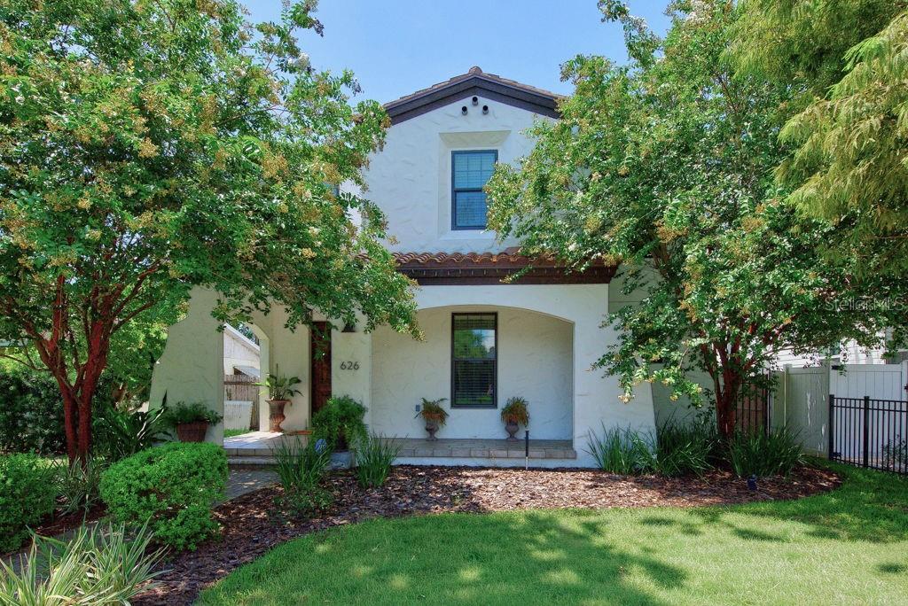 Set in the sought-after Allendale neighborhood of St. Petersburg, this beautifully maintained Mediterranean-style home offers the space, style, and flexibility you are looking for. Built in 2016 and move-in ready, the home features 5 bedrooms, 3.5 baths, a 2-car garage, and 2,568 square feet of thoughtfully designed living space. From the inviting front porch to the warm, open interior, the home makes an immediate impression. The main living area is bright and comfortable, with wood flooring, an open-concept layout, and an easy flow between the living room, dining area, and kitchen. The kitchen is designed for both everyday living and entertaining, featuring granite countertops, charcoal stainless steel appliances, generous cabinet space, ample prep area, and a walk-in pantry. Just off the kitchen, a stylish wet bar with a sink, granite counter, and built-in wine cooler adds the perfect touch for hosting. The first floor also includes a flexible bedroom or private office with an attached full bath, ideal for guests, multigenerational living, or a dedicated work-from-home setup. Upstairs, the spacious primary suite offers a walk-in closet, separate shoe closet, and a large en-suite bath with dual vanities, a glass-enclosed shower, and a jetted tub. The second level also features additional bedrooms, a conveniently located laundry room, and a large bonus-style bedroom with two closets and a half bath that could easily serve as a media room, playroom, second living area, or guest retreat. Outdoor living is just as inviting, with a spacious backyard offering plenty of room to relax, entertain, garden, or add a pool. A gated alley-access driveway leads to the 2-car garage, providing added convenience and privacy. Located in one of St. Pete’s most desirable and steadily growing neighborhoods, this Allendale home delivers newer construction, flexible living spaces, and a prime location close to local dining, shopping, parks, downtown St. Petersburg, and Gulf beaches.