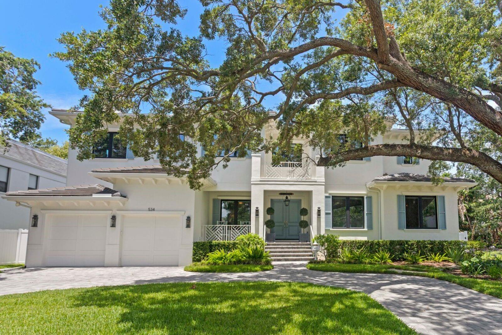 Situated on picturesque Davis Islands, one of Tampa’s most desirable waterfront communities, this Dutch West Indies inspired home has 6 bedrooms, 4 full baths, 2 half baths, plus a gym, media room, study/library, formal dining room with sitting room, and expansive open concept living room. The moment you enter this home, you feel the craftsmanship and attention to detail with a soaring 22’ entryway, beautiful custom milled coffered ceilings, crown molding, and wainscoting.
The blend of open concept with traditional layout is further enhanced with the wide plank hardwood flooring that flows throughout the home. The living areas have 10’ ceilings; this ceiling height, combined with the countless oversized casement impact windows, garners wonderful natural light throughout the home.
The GOURMET kitchen is a timeless design, with sparkling QUARTZ countertops (marble design), 48” Wolf gas range, Sub-Zero 48” refrigerator, custom wood cabinetry, TWO oversized islands with storage and prep sink, farmhouse sink with Kohler faucet, and Calacatta stone backsplash. Additional kitchen enhancements include large eat-in space, oversized walk-in pantry, and separate butler’s pantry with wet bar, secondary dishwasher, and wine fridge (perfect for entertaining). The first floor is a wonderful use of space, including a formal sitting and dining room separated by the gas burning fireplace, plus a beautiful study/library with glass French doors, custom shelving, and lighting. There is a private guest suite on the first level, with full bath that also serves as a pool bath.
Outdoor living is equally impressive with heated, salt-filtered pool and spa, expansive sun shelf, and an oversized screened lanai designed for both dining AND lounging. The fully equipped outdoor kitchen includes a natural gas grill, hood exhaust, beverage refrigerator, and sink. Artificial turf and lush professional landscaping enhance privacy, while exterior landscape lighting creates a stunning evening ambiance.
The second level of the home is just as impressive with an oversized primary suite with spa quality bath. The primary bath is clad in marble with oversized glass walk-in shower, multi rain and jet shower heads, modern freestanding soaking tub, dual vanities with prep space, and two large walk-in closets. The second level also contains 3 additional guest bedrooms with wood flooring, walk-in closets, and private full baths, as well as a DEDICATED gym (equipment included) and fully customized MEDIA room featuring a full wall projection screen with projector, Yamaha amplifiers, soundproof acoustical tiles, blackout shades, and a private half bath. This space also houses the home’s FULL AUTOMATION system (ELAN) that controls all lighting, window shades, sound system, CCTV cameras, security system, and media to TVs.
Additional features include 38kw WHOLE HOME GENERATOR (liquid cooled), 3 car garage with EV charging and epoxy floor, whole home water softener, point of source water filtration system, 2 tankless gas water heaters, 3 A/C systems, custom drop zone (with seating and storage), and cement tile roof.
Located on Davis Islands, a vibrant and walkable community. The neighborhood is home to a wealth of amenities, including Marjory Park Marina, Freedman Tennis Complex, Roy Jenkins Pool, Peter O. Knight Airport. the DI Village (restaurants and shops). This prime location is minutes from Downtown Tampa, Water Street, Sparkman Wharf, and the Tampa Riverwalk.