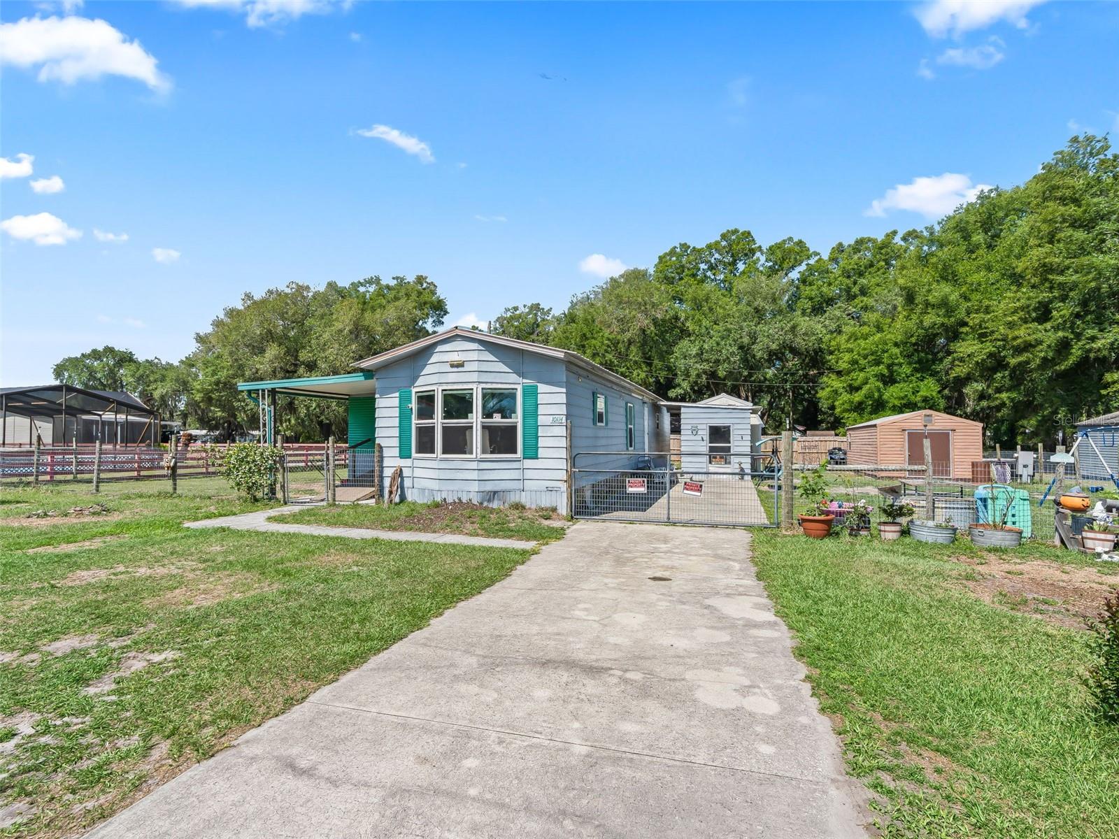 NO LOT RENT - YOU OWN THE LAND - NO HOA -OWNER MOTIVATED, READY TO NEGOTIATE

Whether you're searching for your first home, a relaxing snowbird retreat, or a smart investment opportunity, this property checks all the boxes. Set on a spacious .26-acre lot with no HOA, you’ll enjoy the flexibility of country living with room to make it your own. This 2-bedroom, 1-bath manufactured home (854 sq ft) offers a comfortable and functional layout, plus a 12x20 enclosed Florida room that adds valuable living space—perfect for a second living area, home office, or seasonal enjoyment. The seller states these key updates have already been completed, including the bathroom and plumbing (2024), windows and water heater (2025), and HVAC new in 2025 and recently serviced HVAC (2026), providing peace of mind for homeowners and investors alike. Outside, the property continues to impress with fencing on both sides and along the back for added privacy, a 12x20 workshop with electric for hobbies or storage, and an 8x10 metal laundry/storage building with washer and dryer hookups. The septic system was pumped in 2025, helping minimize immediate maintenance concerns. Conveniently located with easy access to SR 471, SR 50, US 301, and I-75, this home offers a great balance of quiet living and accessibility to medical offices, shopping, farmers' markets, and entertainment. Just a short drive to Tampa, Orlando, The Villages, and Ocala. Whether you're planning to live in it full-time, use it seasonally, or add it to your rental portfolio, this property offers versatility and value.