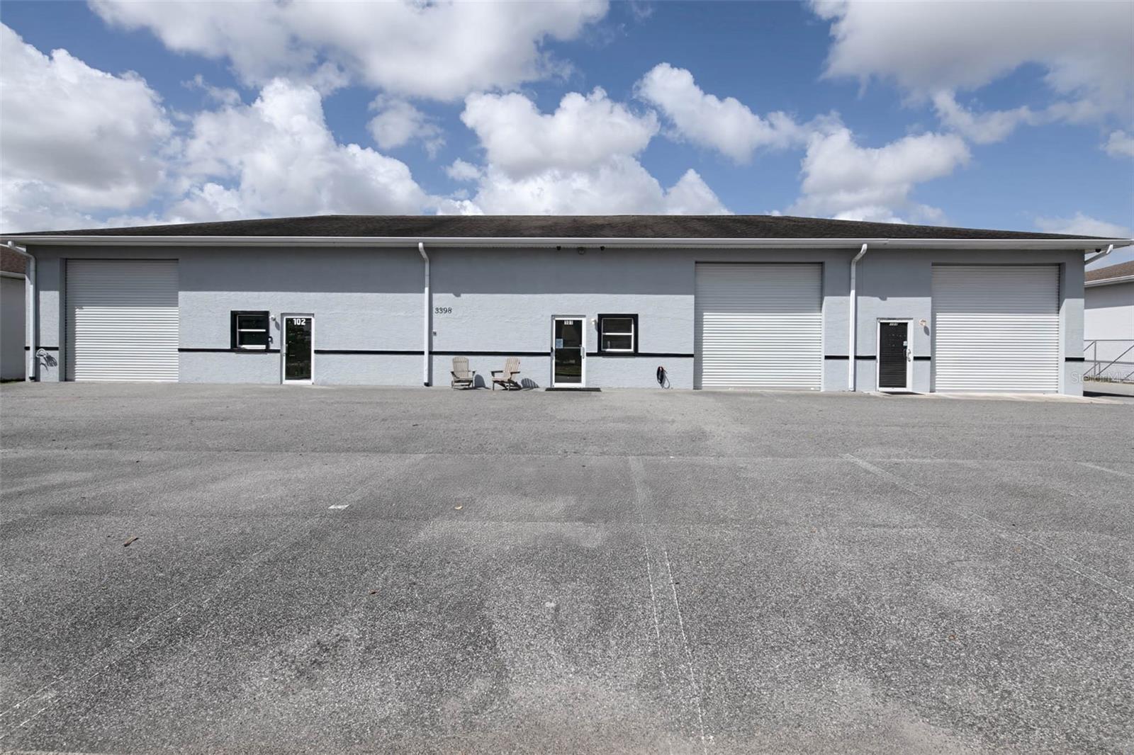 Airport Industrial Park | Near Ocala International Airport & World Equestrian Center. 4.39 arcers with 5350 sq. ft. Ft. building.
This freestanding industrial building, located in the established Airport Industrial Park, offers a strategically located opportunity to acquire a well-positioned commercial property with additional land and expansion potential in one of Ocala’s most active industrial corridors.
Situated at 3398 SW 74th Avenue, just off SW 38th Street, the property sits on 0.65 acres with paved asphalt access and in the immediate proximity of the Ocala International Airport and in excellent proximity to the World Equestrian Center, located approximately 10 minutes away.
The building is configured as two separate units, each with its own office, restroom, and utilities, making the property well-suited for an owner-user, contractor headquarters, or investment property with dual-occupancy potential.

Concrete block construction
Slab foundation
Interior bay height of 14 feet
Freshly painted exterior
Mezzanine Storage Areas in both bays
Overhead Doors & Access:
Left Bay
(1) 12' x 12' overhead door – front
(1) 12' x 12' overhead door – rear. "Ideal for drive-through needs."
Right Bay
(1) 12' x 12' overhead door – front
(1) 12' x 12' overhead door – rear. "Ideal for drive-through needs."
An additional 12' x 12' overhead door - front. (1) 12' x 8' in rear. "Ideal for drive-through needs."

Each bay also includes:
Front man door
Rear man door
Front window
Rear Covered Work Area over two of the rear overhead and man doors 
The rear of the building features a large covered metal awning approximately 20' x 75', providing substantial covered space for:
Equipment staging
Covered loading
Material storage
Outdoor workspace
Additionally, behind the building is a 25' x 25' carport structure, open at the front end, providing additional covered storage or parking.

Utilities & Infrastructure:
Each unit operates independently.
Separate electric meters
Separate water meters
110 & 220 single-phase electric
Public water supply
Septic sewer system

HVAC:
Each unit includes central air conditioning serving the office areas.
One HVAC unit is approximately 5 years old
One HVAC unit is approximately 2.5 years old

Site Improvements:
8 parking spaces +
1 ADA parking space
Asphalt roadway access
Asphalt driveway and parking area in front of the building
Curbing along the front.
Chain-link fencing surrounds the property on three sides.

Drainage System:
The building includes a functional roof drainage system.
Front and rear gutters discharge through downspouts, then through underground drainage lines
Side gutters discharge through standard downspouts.

Grounds:
The front yard area is beautifully maintained and meticulously manicured, contributing to the property’s excellent curb appeal and professional appearance.

Additional Land:
The sale includes an adjoining vacant lot located behind the building, providing egress to 3.74 acres of additional vacant land.
This creates strong opportunities for:
Contractor equipment yards
Storage expansion
Future industrial development
Operational flexibility
Properties offering a building plus expansion land near the airport are rarely available in this area.
Location Advantages
Located in Airport Industrial Park
Adjacent to Ocala International Airport
Approximately 10 minutes to the World Equestrian Center
Growing commercial and industrial corridor