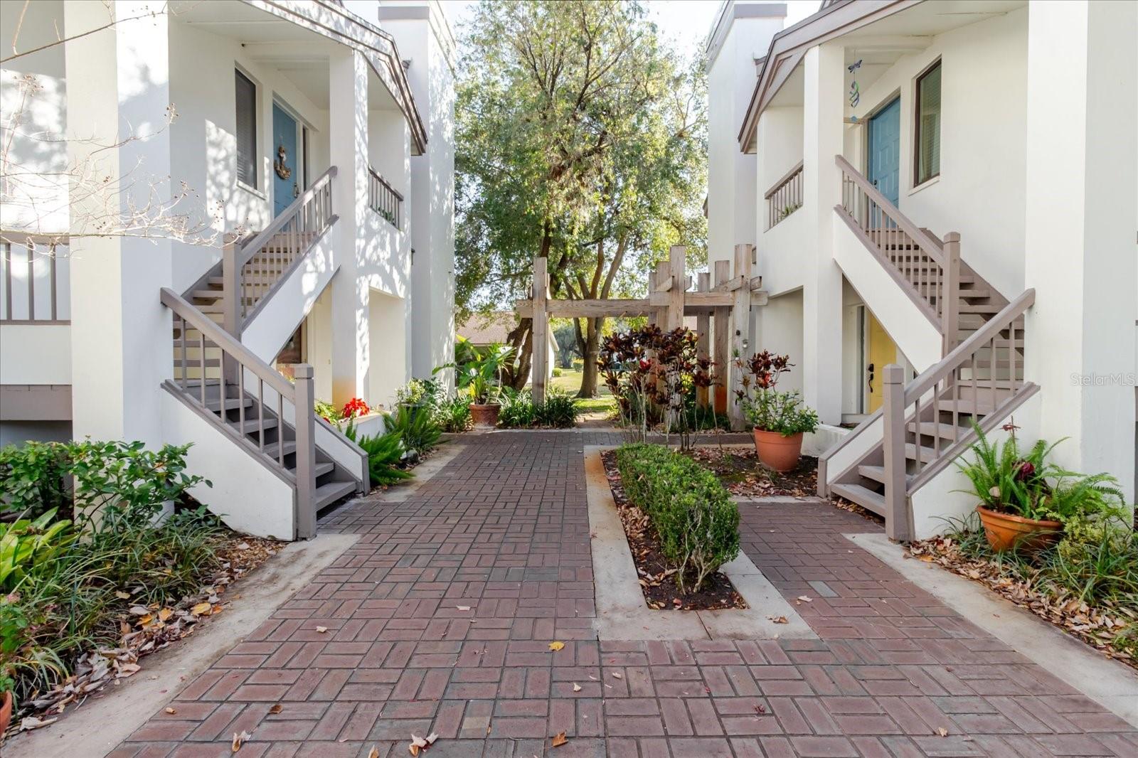 HUGE HUGE HUGE PRICE IMPROVEMENT!!!!! MOTIVATED SELLERS, LETS GET THIS PLACE SOLD...  Calling all pet lovers! Welcome to this pet-friendly Safety Harbor community—one of the few that allows up to two pets with generous weight allowances, making it ideal for owners of larger dogs. This beautifully maintained second-floor 2-bedroom, 2-bath condominium offers peace of mind with elevated living, a covered entryway, and views from three sides—plus the added benefit of no flood concerns. The oversized, screened lanai provides a serene retreat and features dual sliding glass doors from both the living room and the primary bedroom. Completely updated and move-in ready, this home showcases true pride of ownership. The open-concept great room is light, inviting, and architecturally appealing, highlighted by vaulted ceilings and a cozy wood-burning fireplace. The bright eat-in kitchen is a standout, featuring rich mahogany cabinetry, marble flooring, stainless steel appliances, recessed lighting, and stunning stone countertops. Additional upgrades include a freshly painted interior, newer carpeting in both bedrooms, and hurricane-rated windows in the kitchen and the primary bedroom sliding door. The spacious primary suite offers a large walk-in closet and a recently remodeled en-suite bathroom. The guest bathroom has also been tastefully updated. Ideally located near beaches, Tampa International Airport, shopping, and dining, this community also offers exceptional amenities just steps away—including a pool, hot tub, entertaining area, and a peaceful gazebo overlooking the pond and fountain. This pet-friendly, beautifully updated condo is truly a rare find and will impress even the most discerning buyers.
