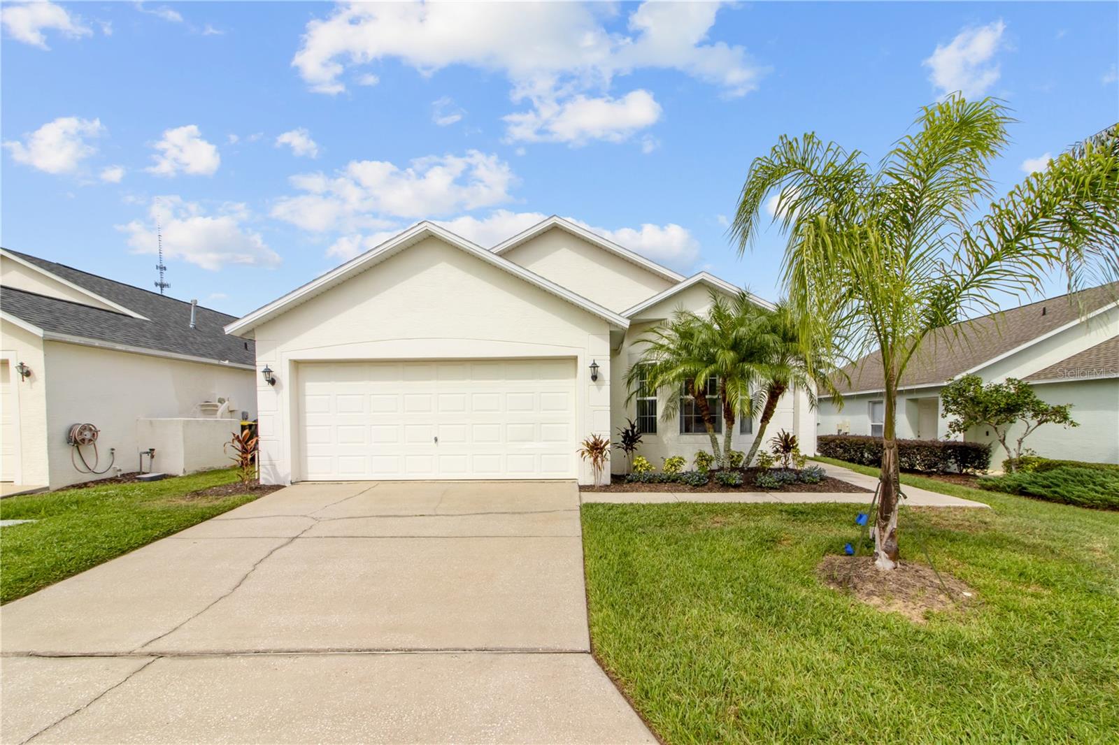 Come see this extremely well maintained, Disney area, pool home today! This adorable home has a bright and open floor plan with vaulted ceilings, large windows and neutral colors. The spacious kitchen has all new appliances.  There are 2 master suites with tons of storage.  The front and back doors were recently replaced along with the A/C in 2022.  The private lanai has a screened-in pool with plenty of deck space- perfect for entertaining and enjoying the Florida sunshine and the landscaping was just updated.  Westbury is an established, clean, highly-sought out community that is centrally located just minutes from the theme parks, shopping, golfing & restaurants. The low HOA fees include lawn maintenance including shrub trimming, sprinkler repair and pest control! This beautiful home can be used as a primary residence, vacation home or short-term rental!